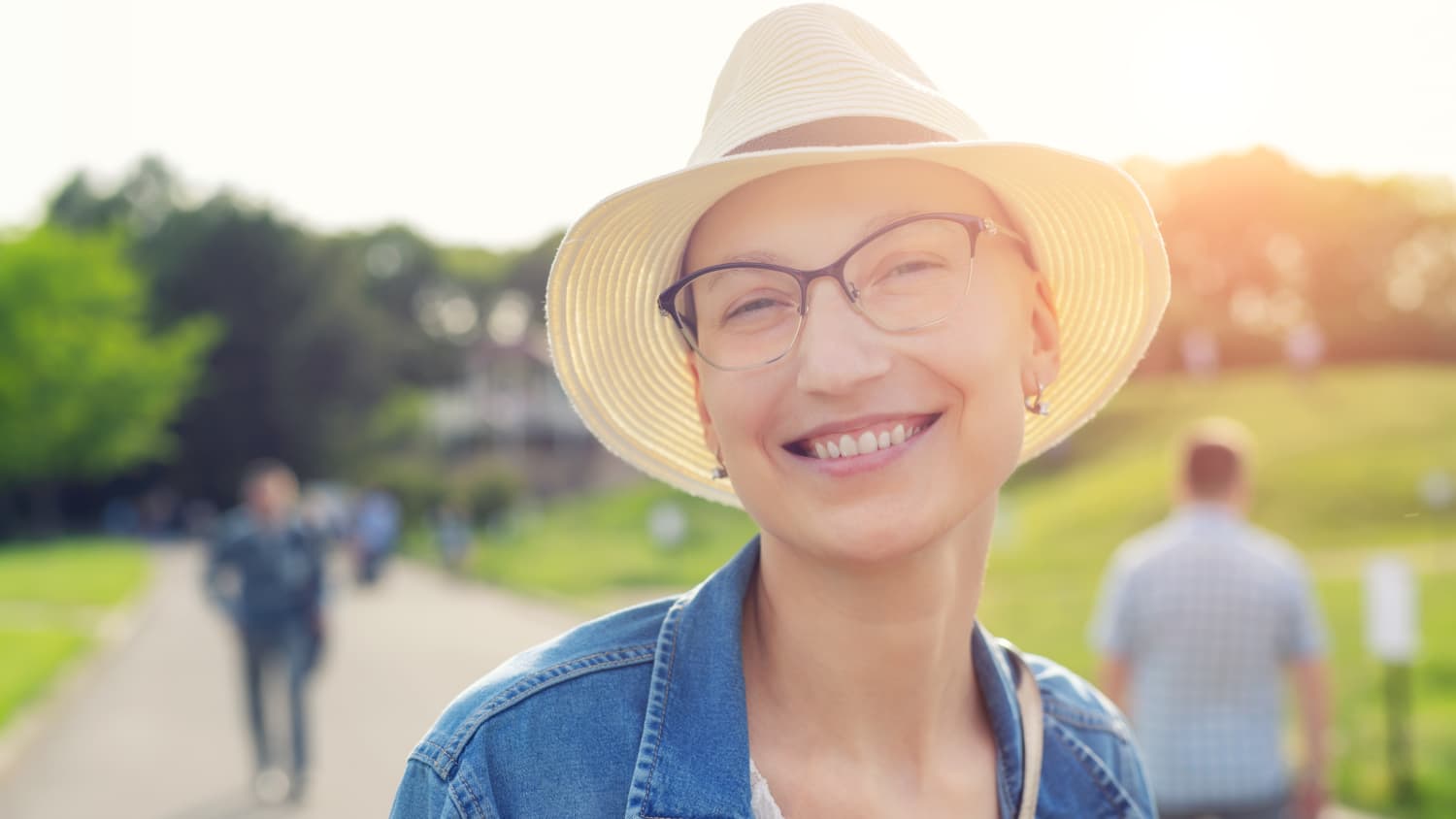 breast cancer survivor smiling while taking a walk