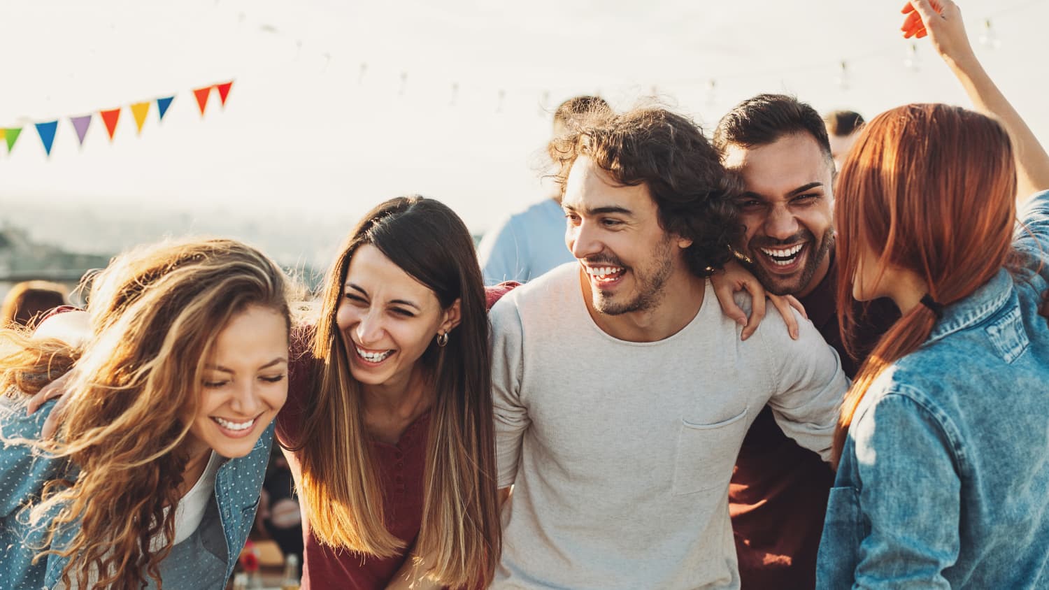 Young men and woman having fun on a beach.