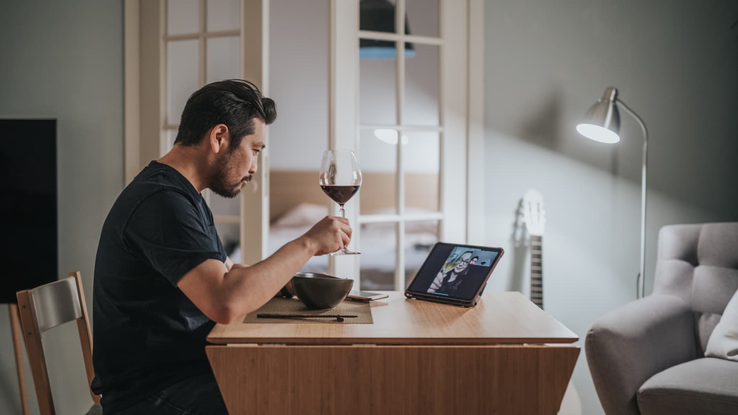 person drinking alcohol alone during the COVID-19 pandemic