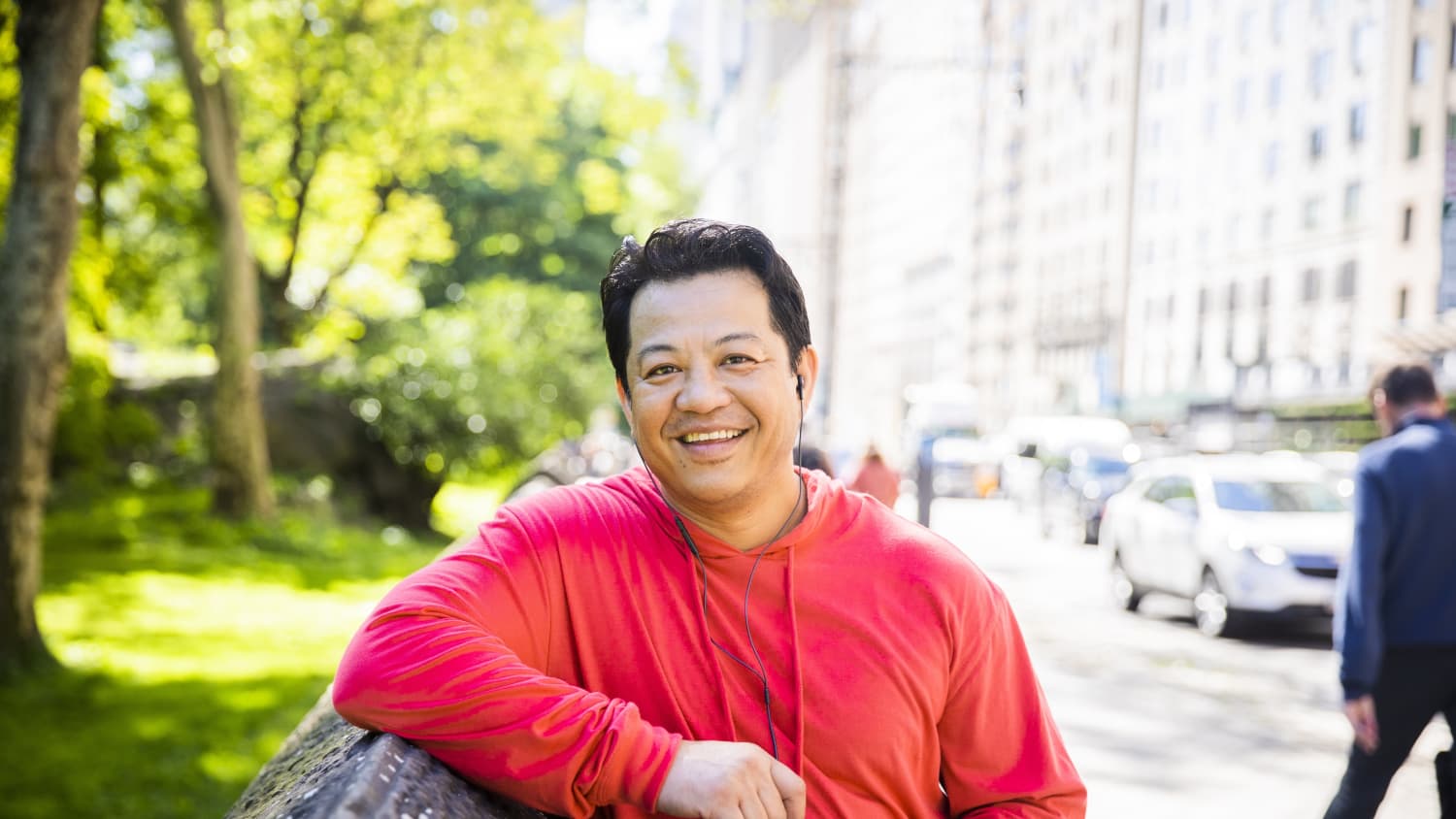 a man smiling after exercise, possibly with familial hypercholesterolemia