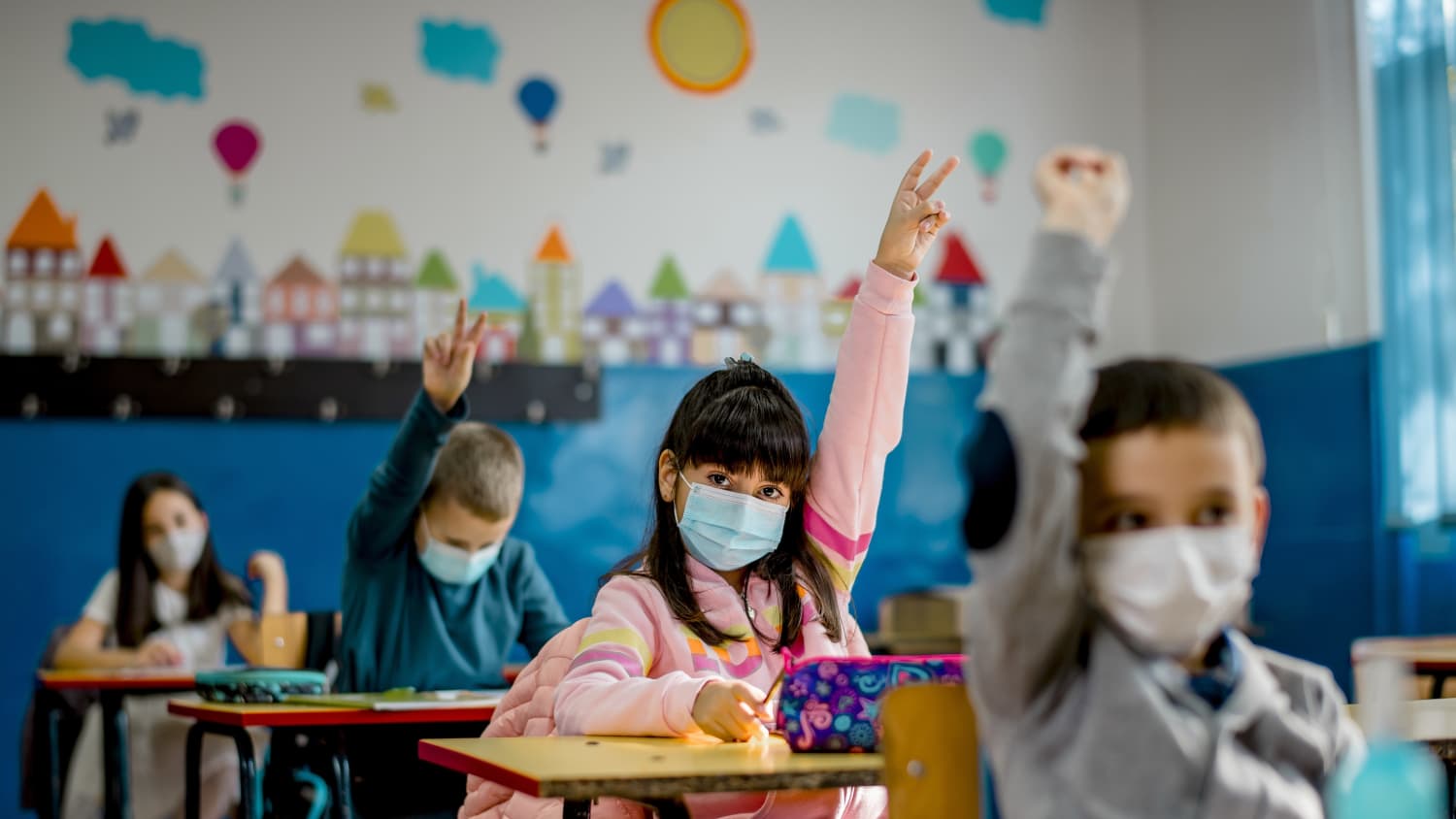 masked kids in a classroom