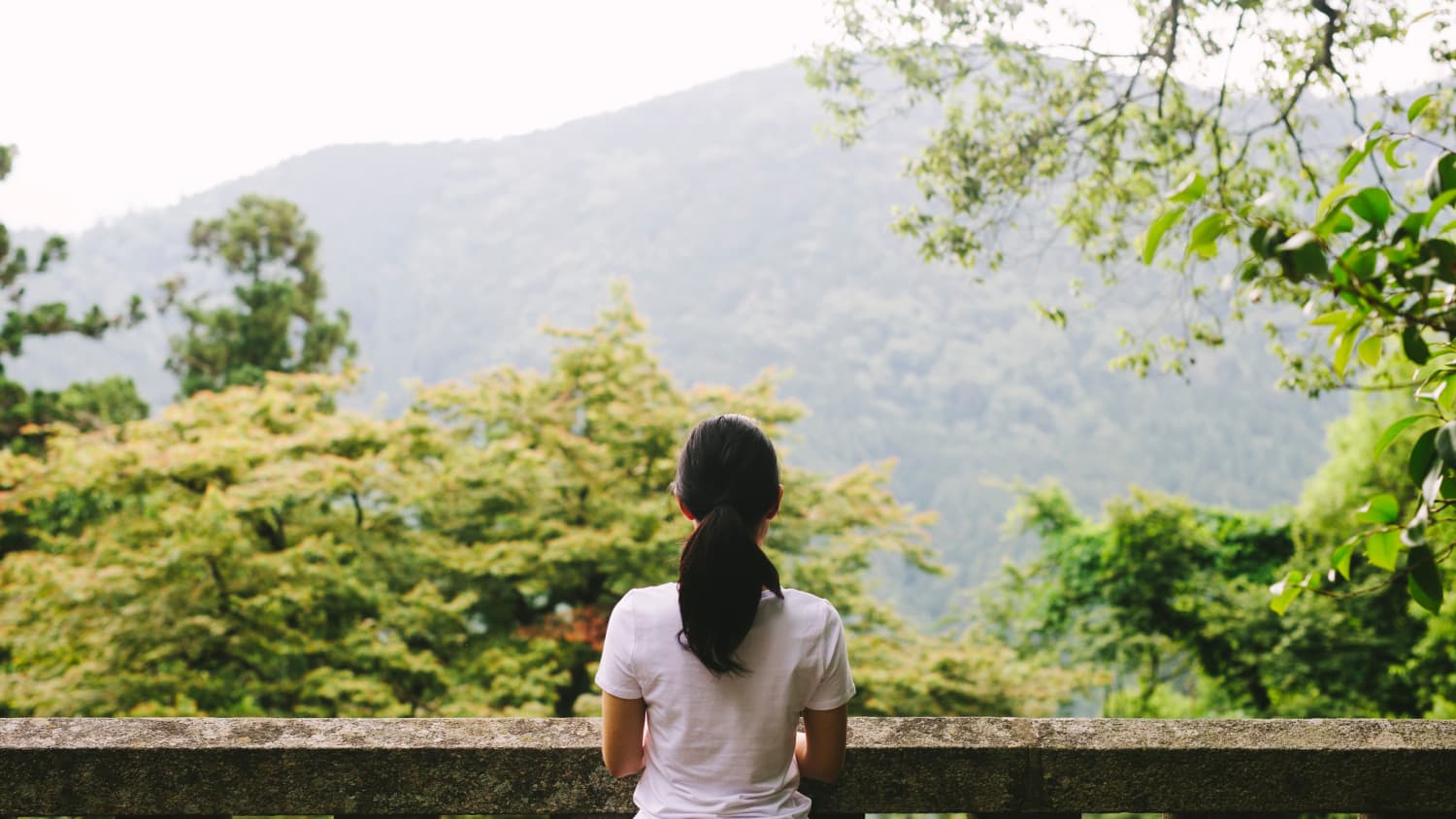 woman contemplating direction in life, especially during a quarter-life crisis