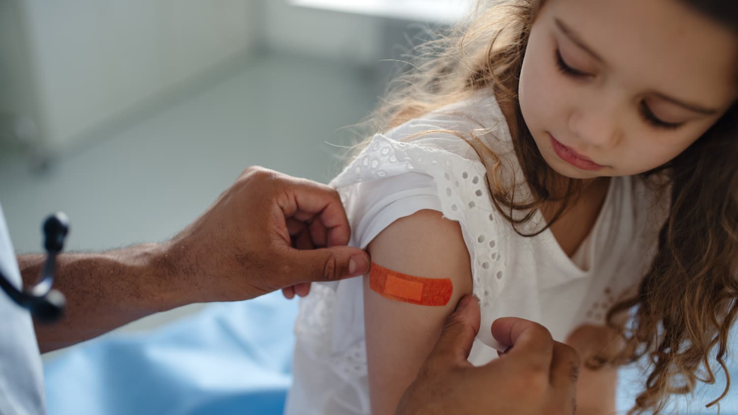 doctor distributing vaccines for kids