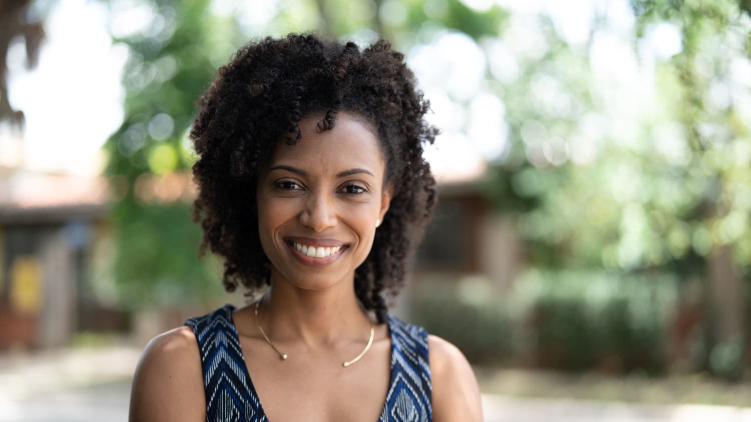 smiling woman who received treatment for blood cancers