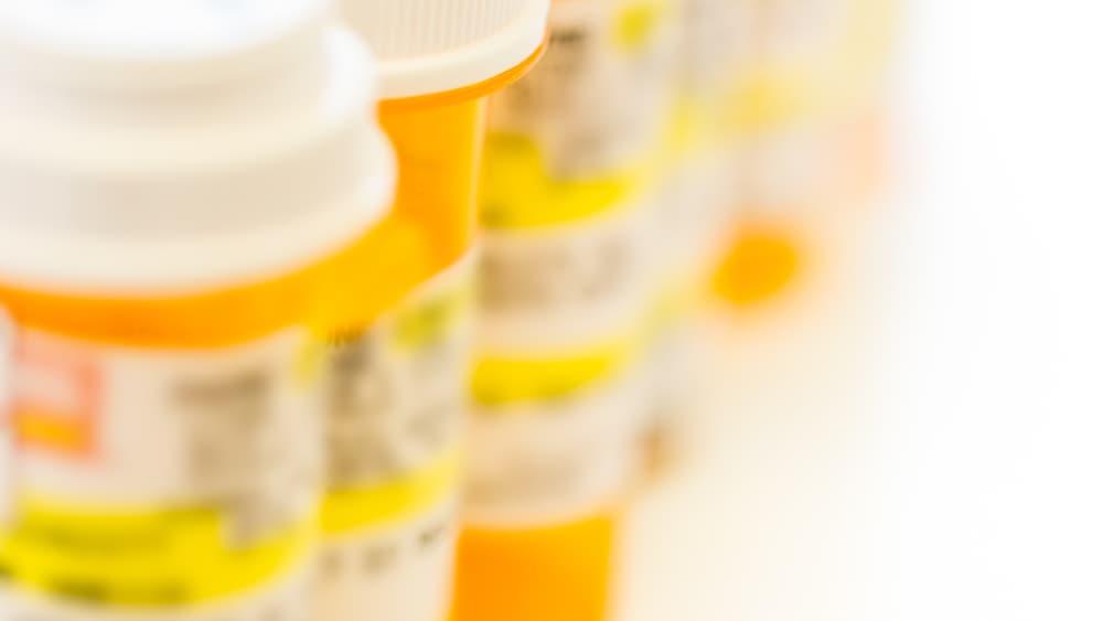 A row of prescription pills for a story about a non-opioid pain medication called suzetrigine (Journavx).