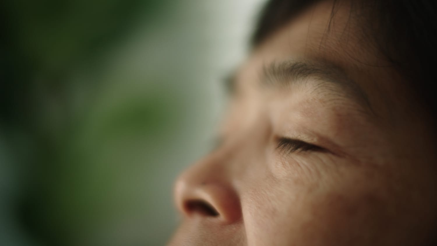woman experiencing Blepharospasm
