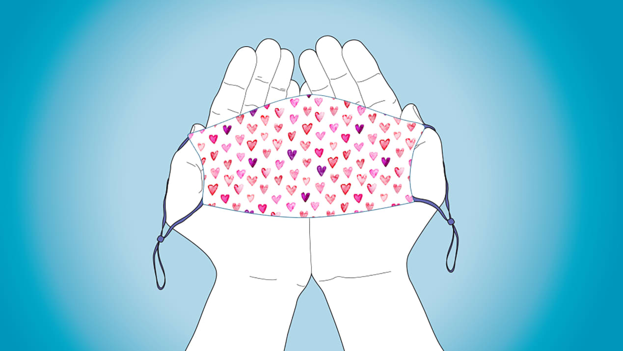 illustration of hands holding a mask with a heart pattern on it