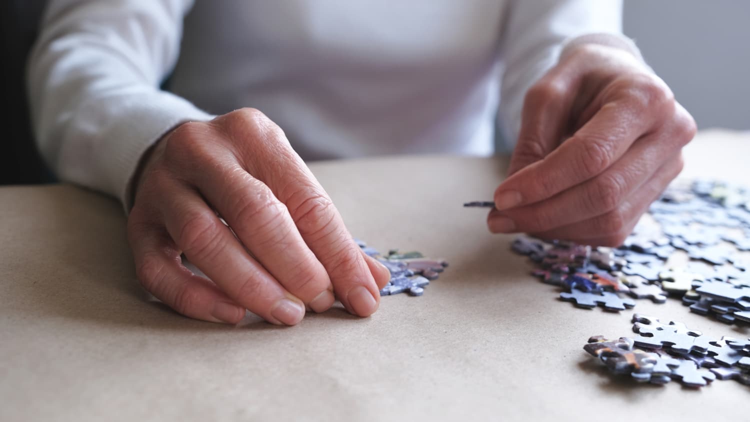 woman doing a puzzle as part of a neuropsychological exam