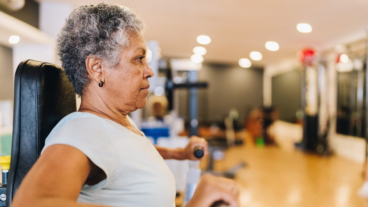 older woman with Parkinson's exercising