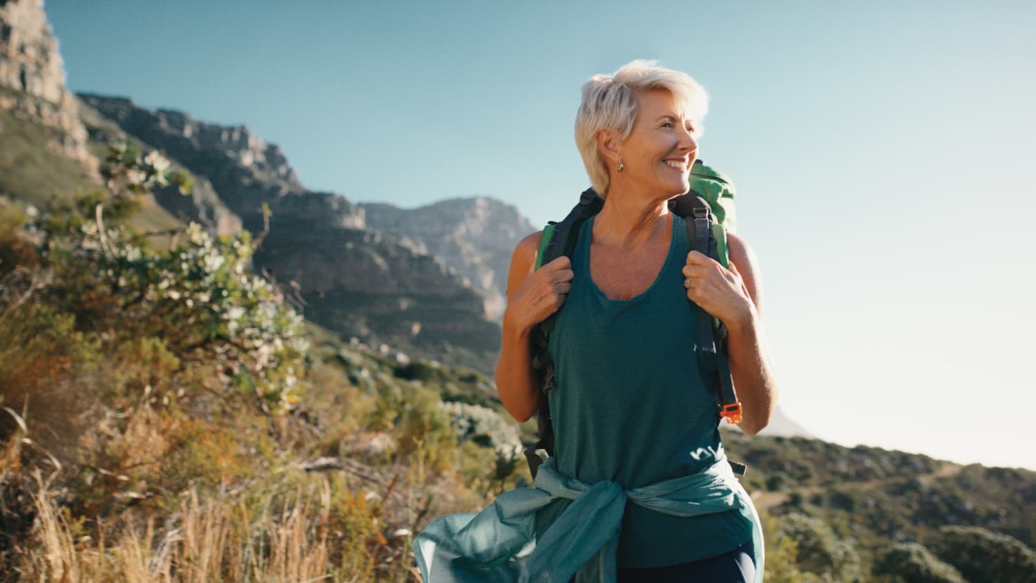 older woman hiking after knee replacement surgery exercises