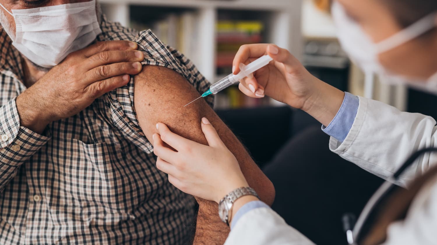 man receiving coronavirus vaccine