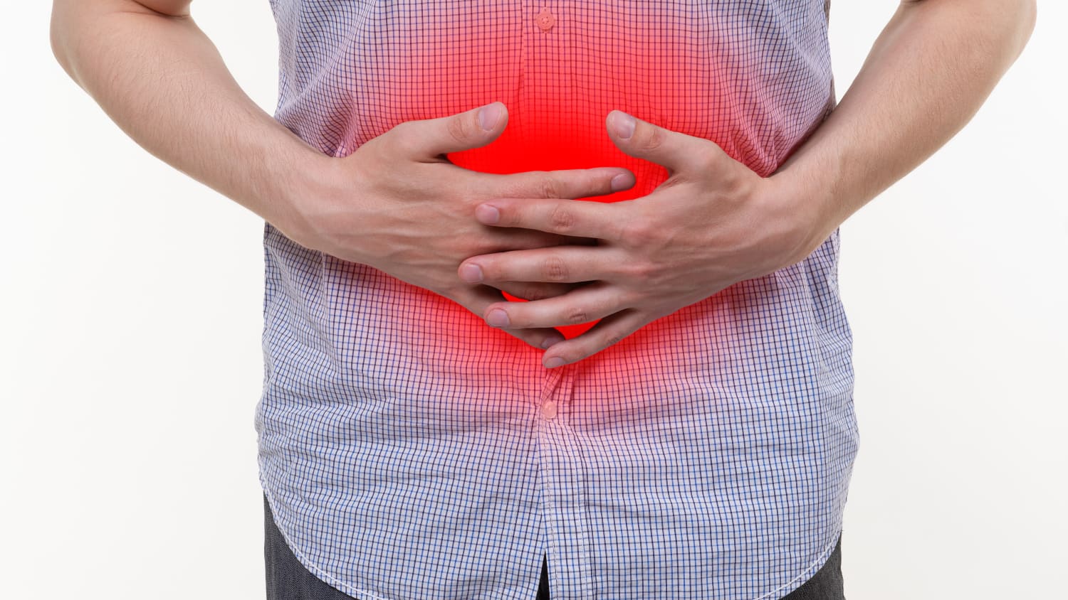 A man with inflammatory bowel disease clutches his stomach, which is highlighted in red. 