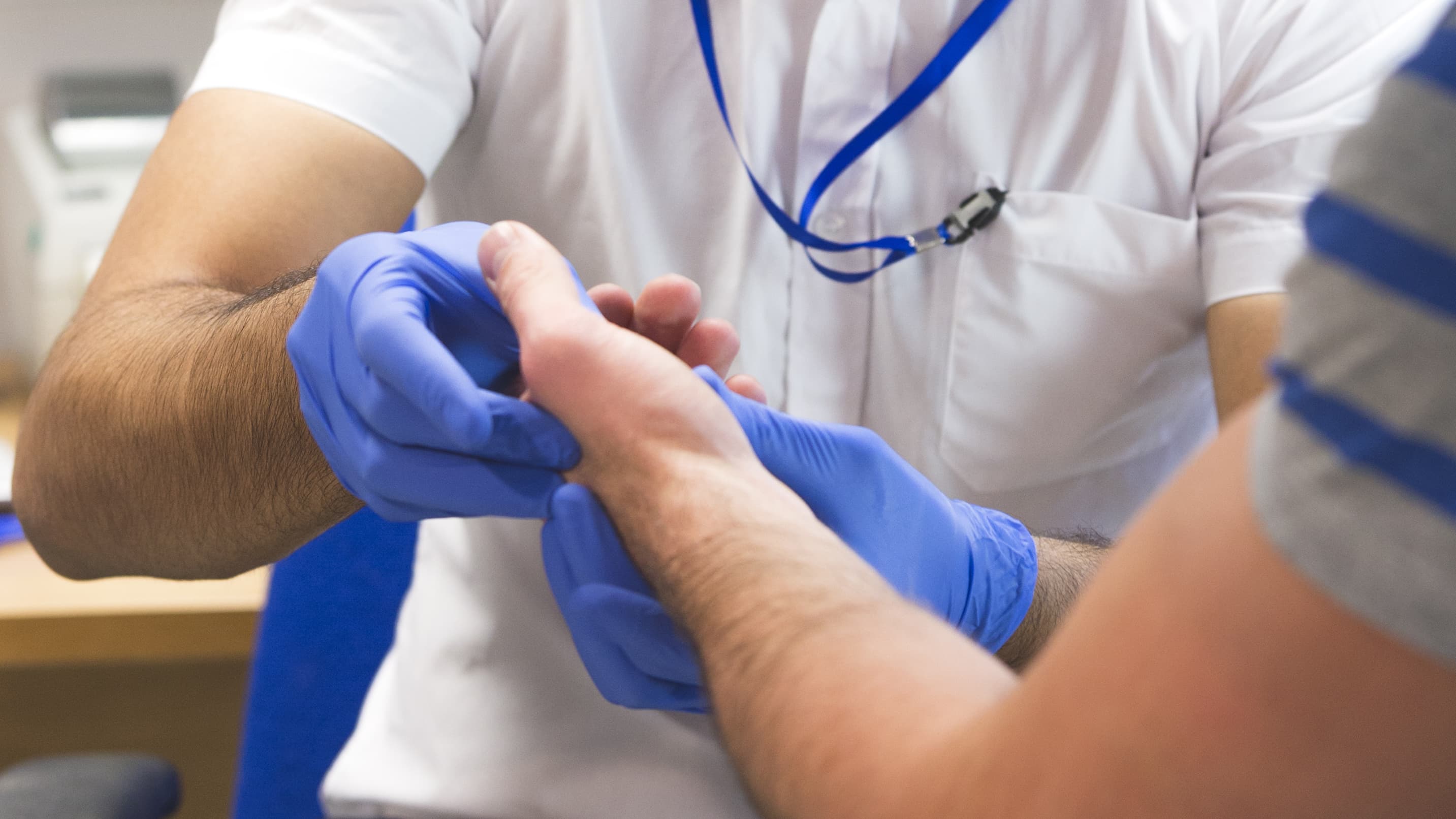 a doctor examines a possible wrist fracture