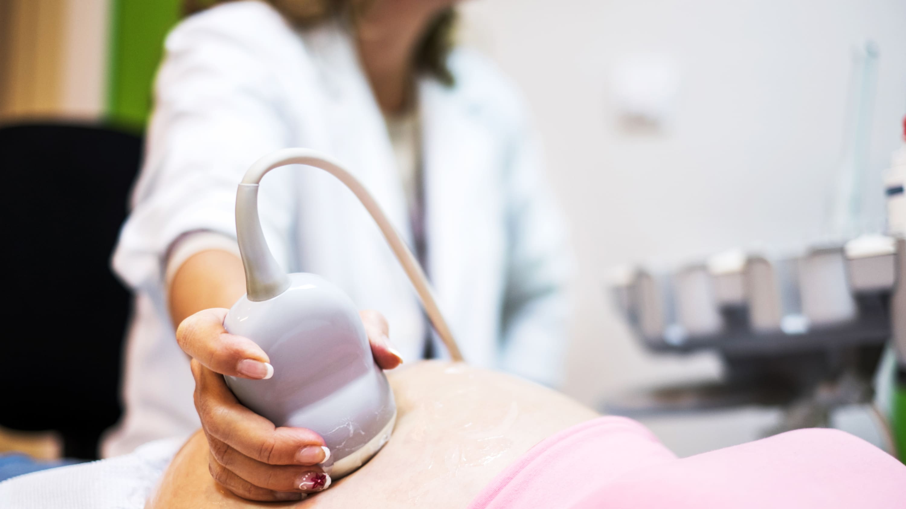 Fetal therapy is performed on a woman with an ultrasound on her belly