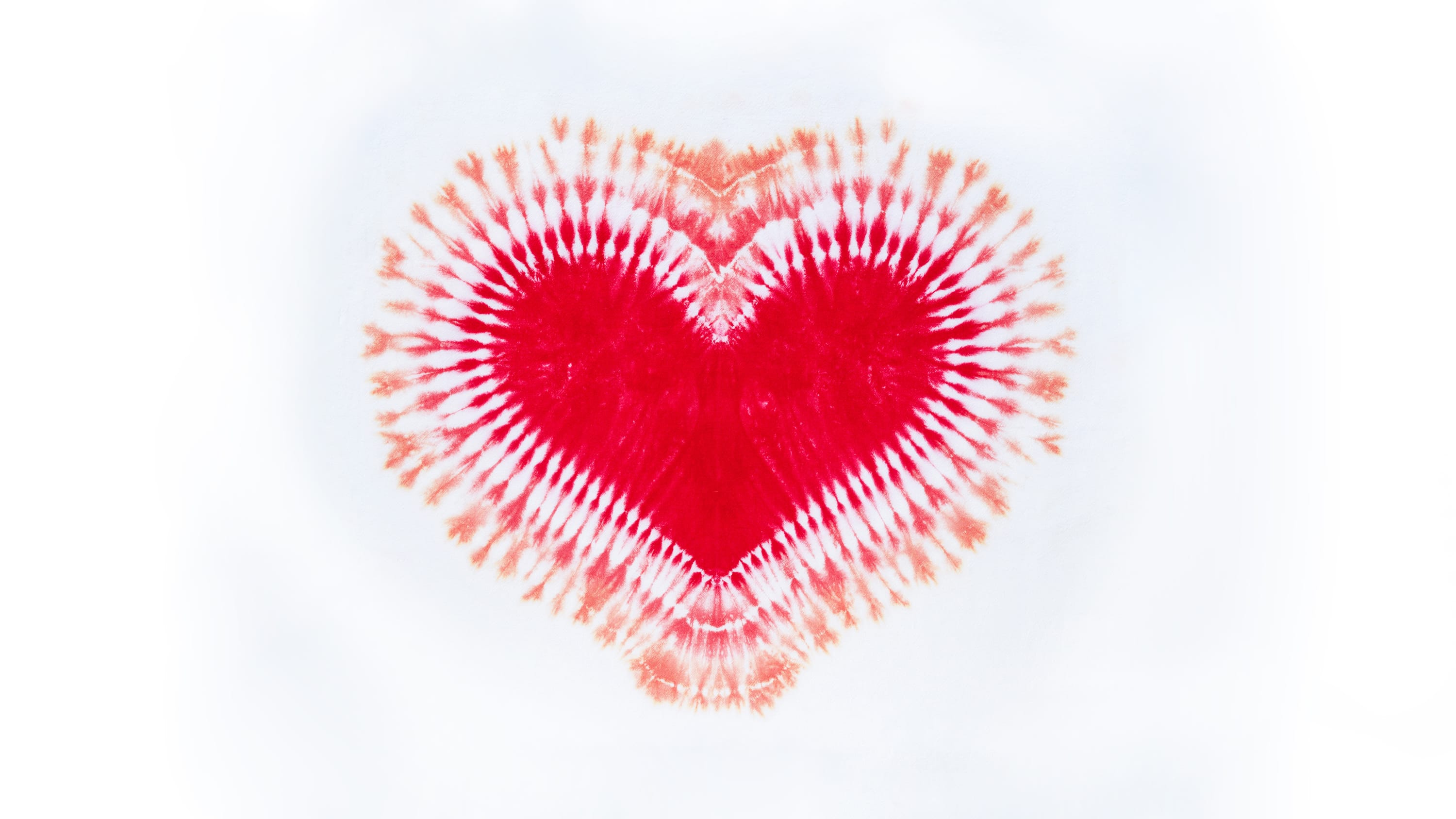 photograph of a tie-dye heart, representing efforts to eliminate the stigma associated with menstruation