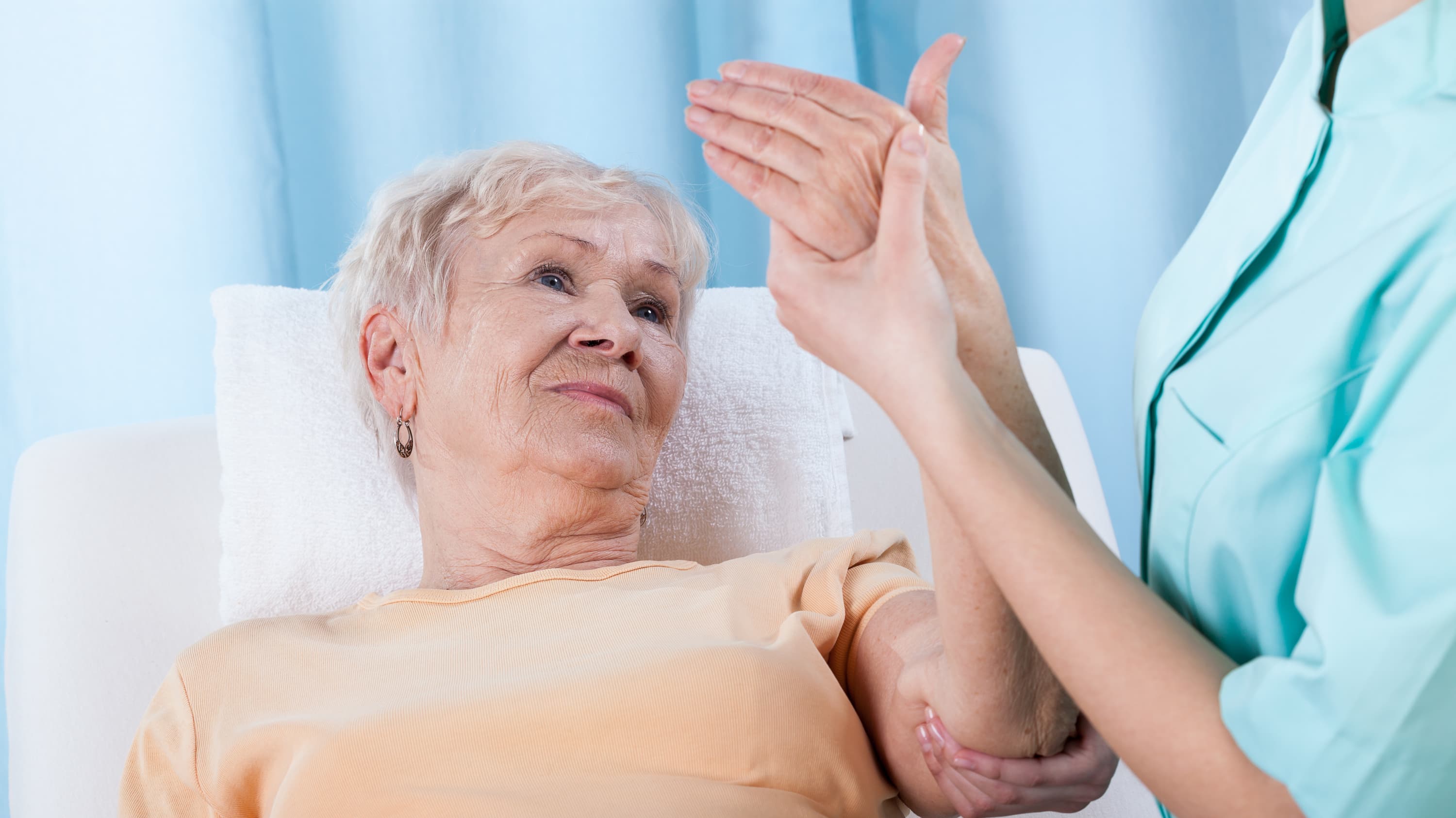 An older woman is checked for osteoporosis.