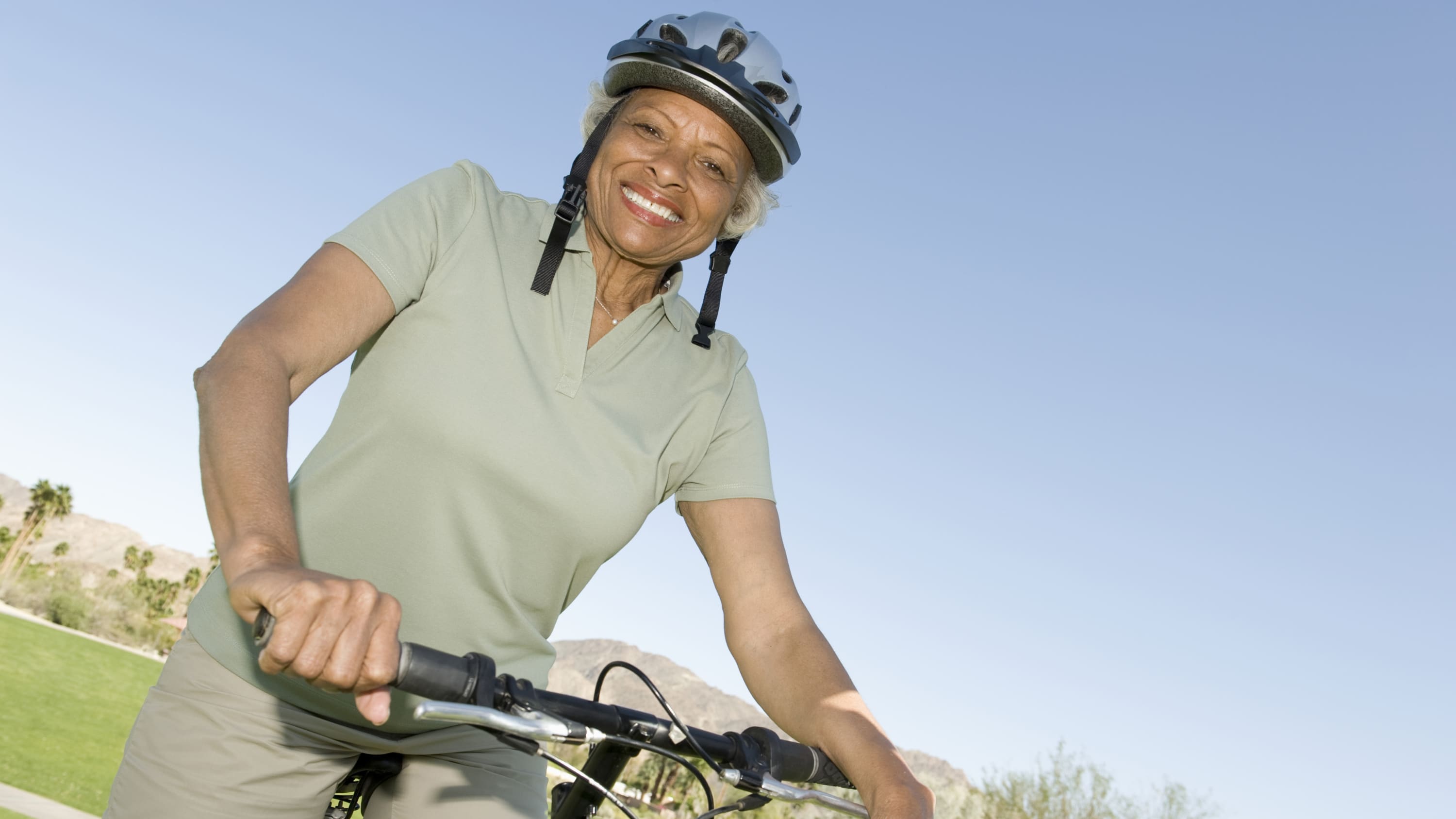 active, older woman smiling, possibly after receiving a total hip replacement