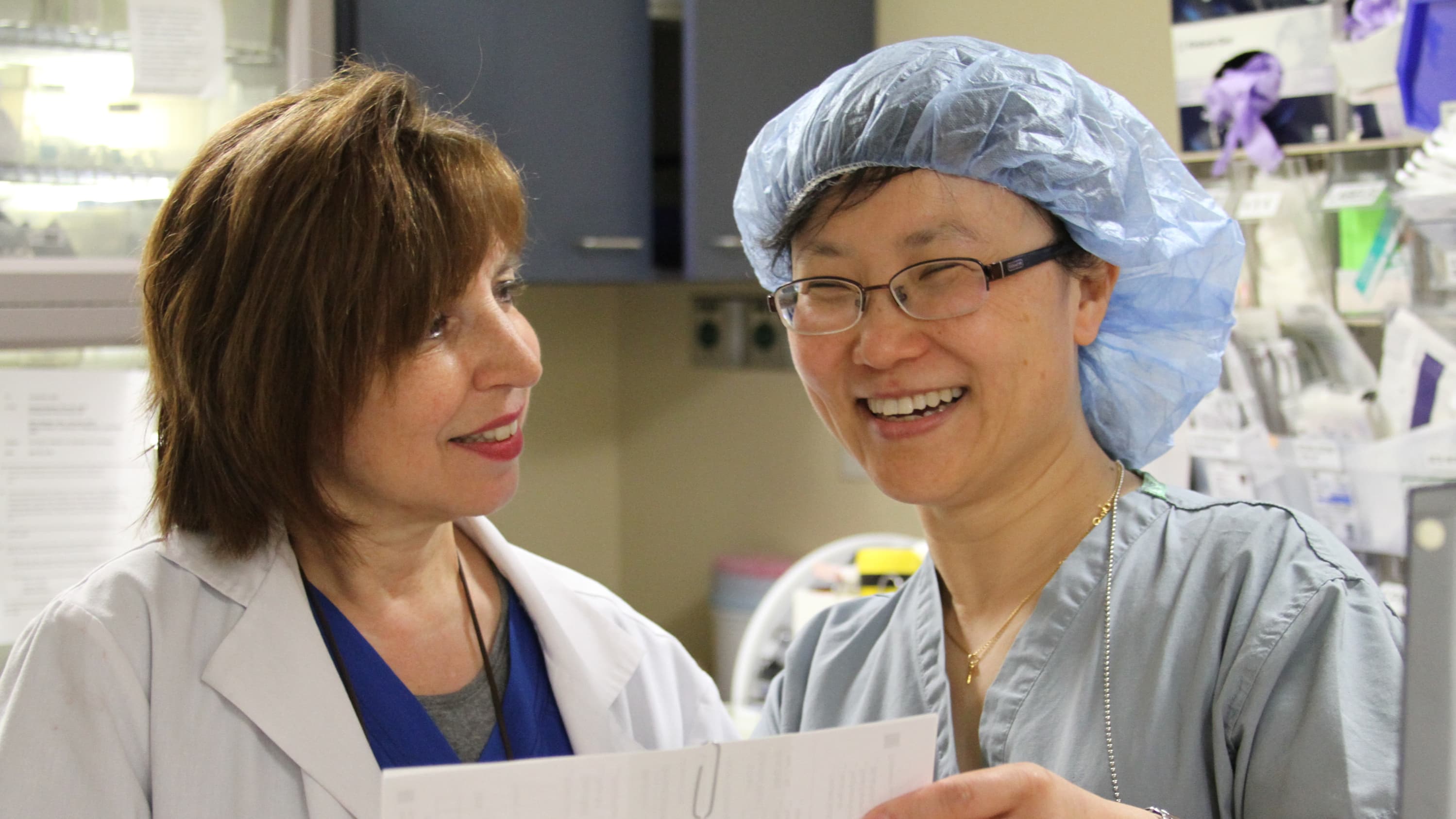Nerve block nurse Lisa Mastrangello (on the left) with Jinlei Li, MD, an anesthesiologist, discussing a nerve block, which is a type of regional anesthesia.