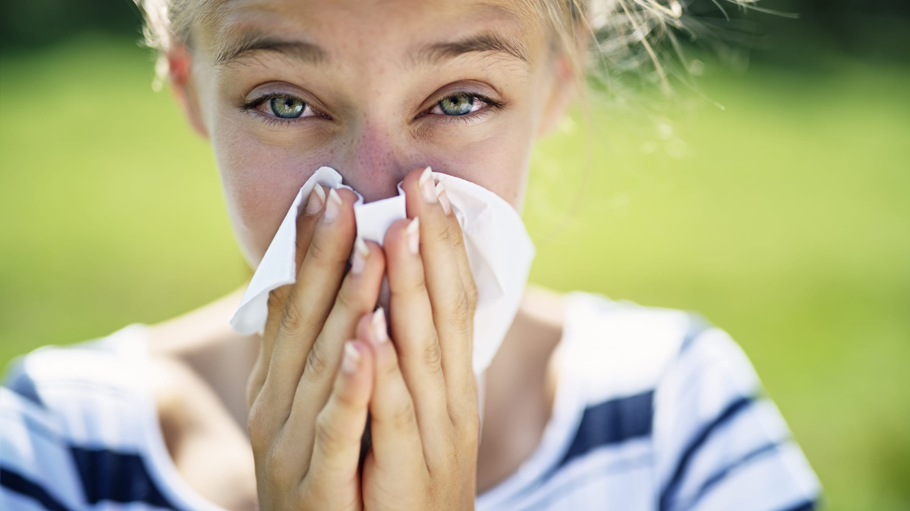 woman with nasal congestion from seasonal allergies