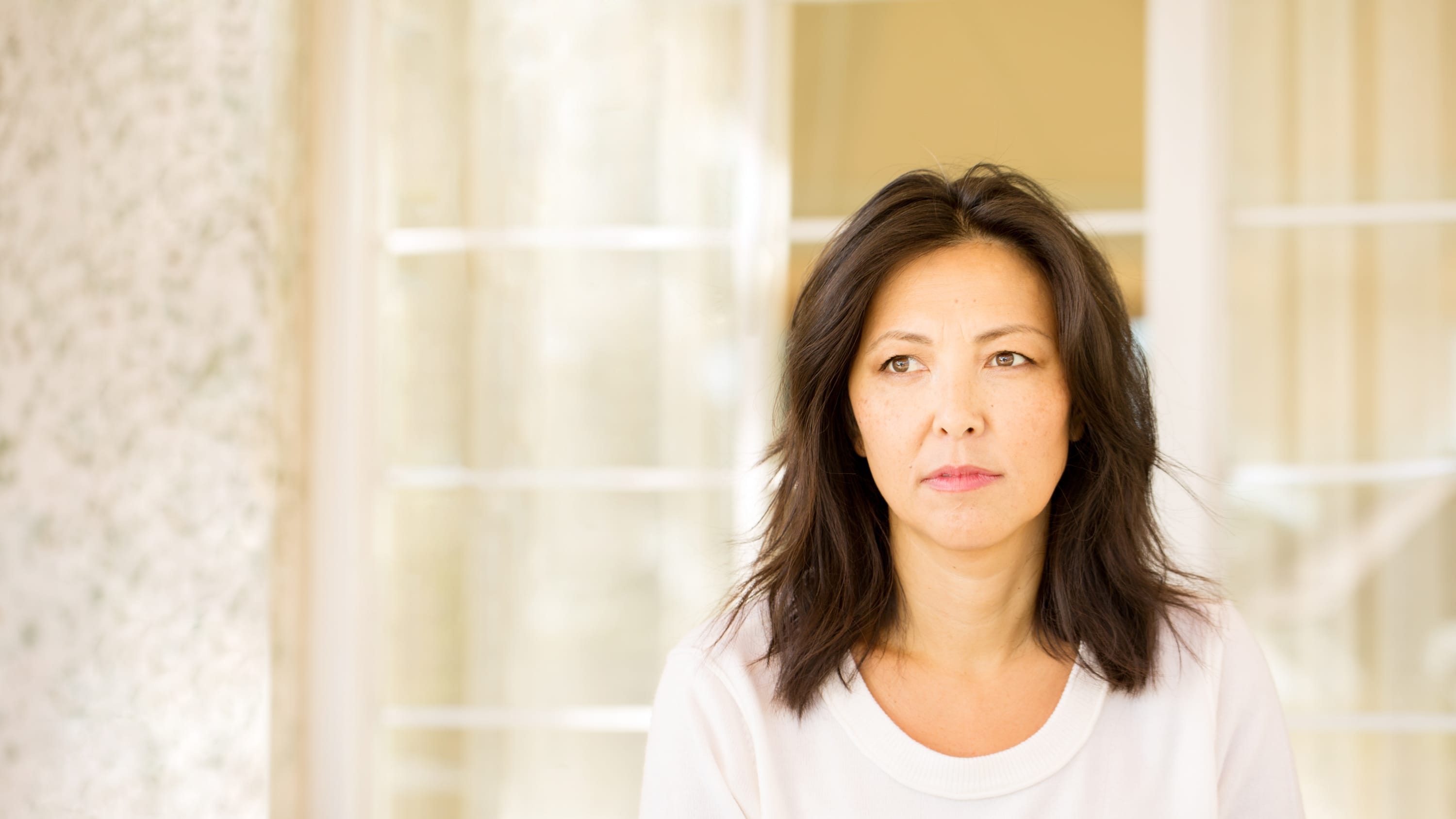 portrait of a woman looking pensive, possibly as a result of receiving a diagnosis of leukemia
