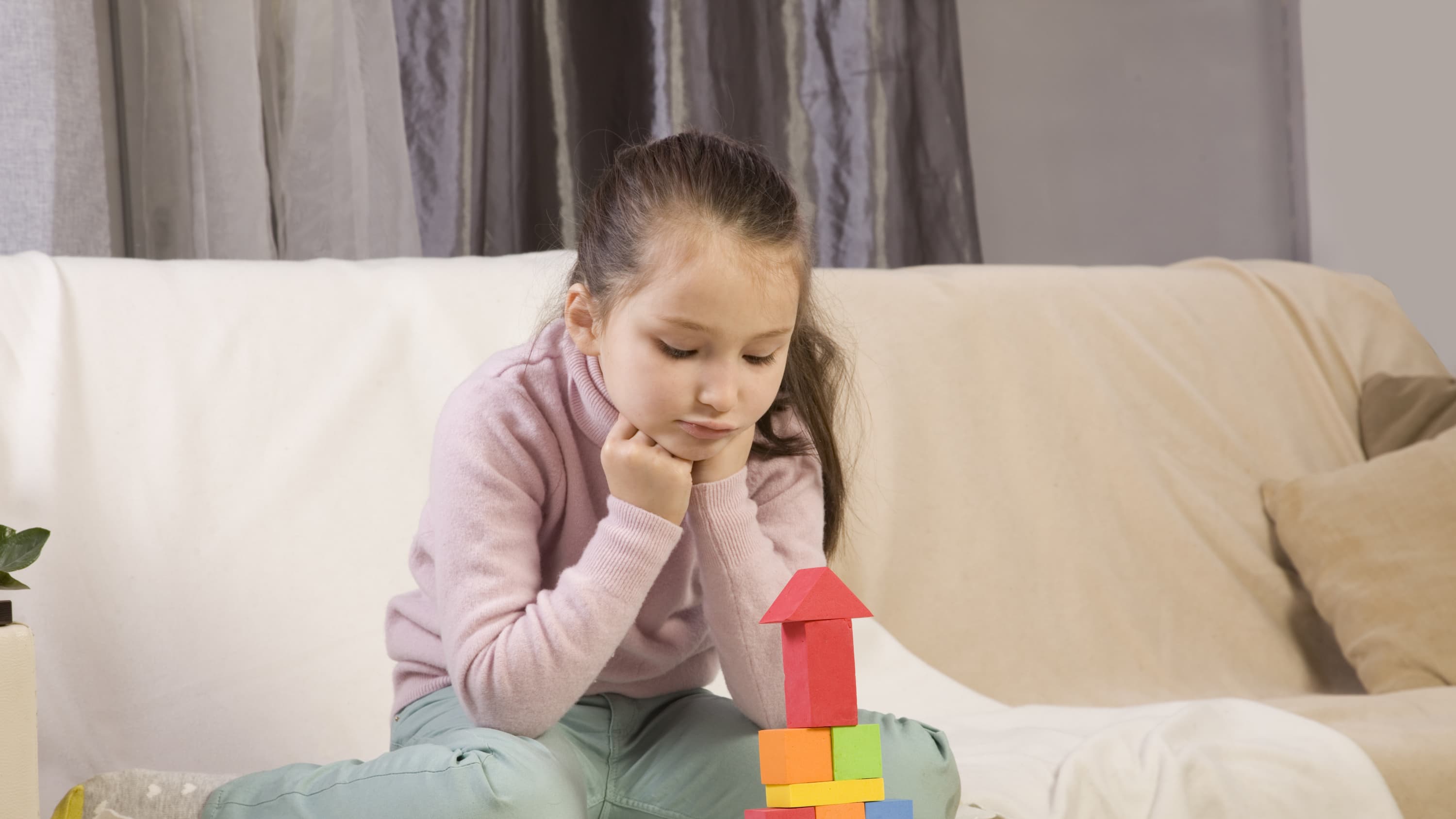 A child playing with blocks may have obsessive-compulsive disorder.