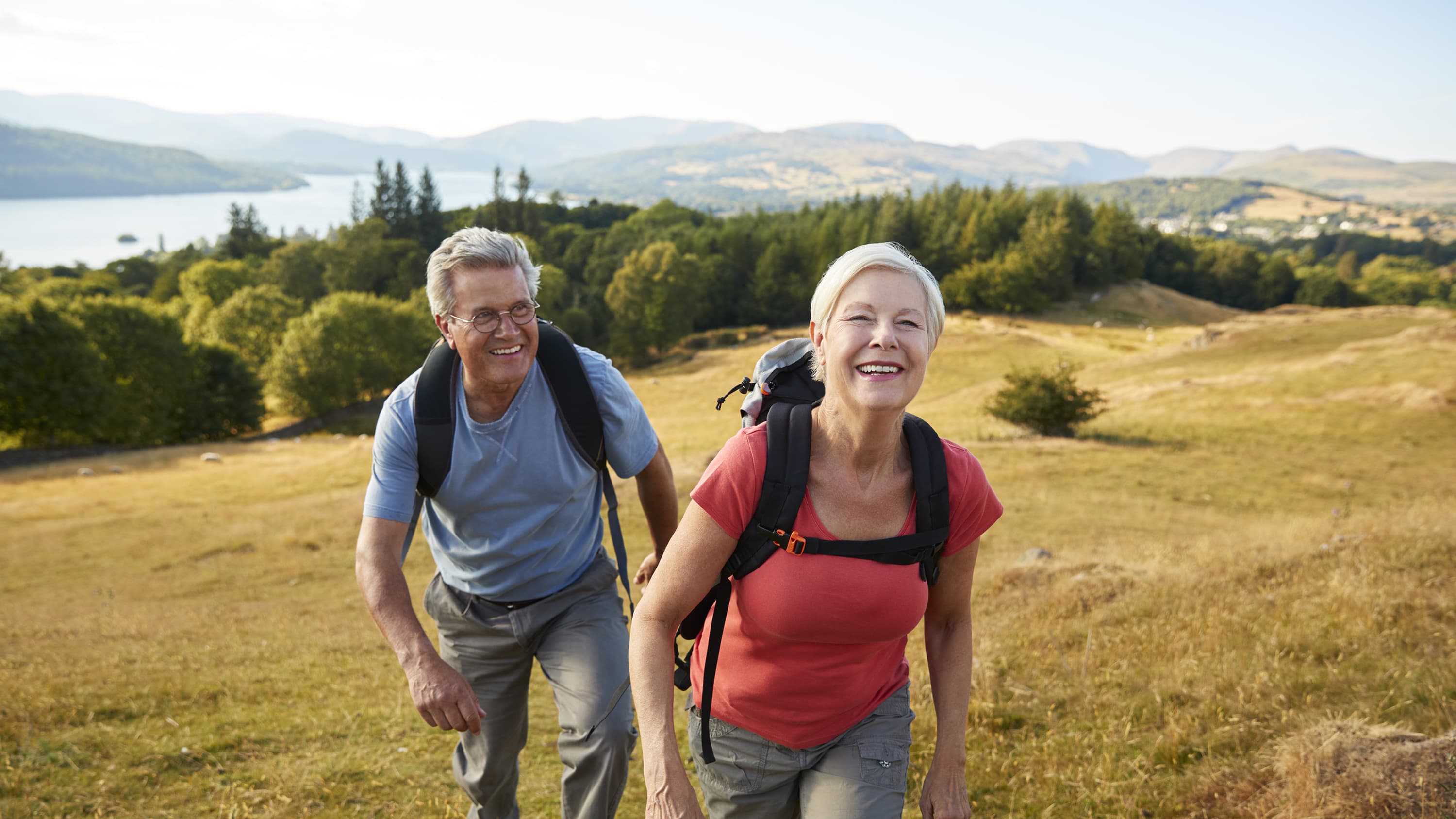 An older couple hiking after undergoing bicuspid aortic valve repair.