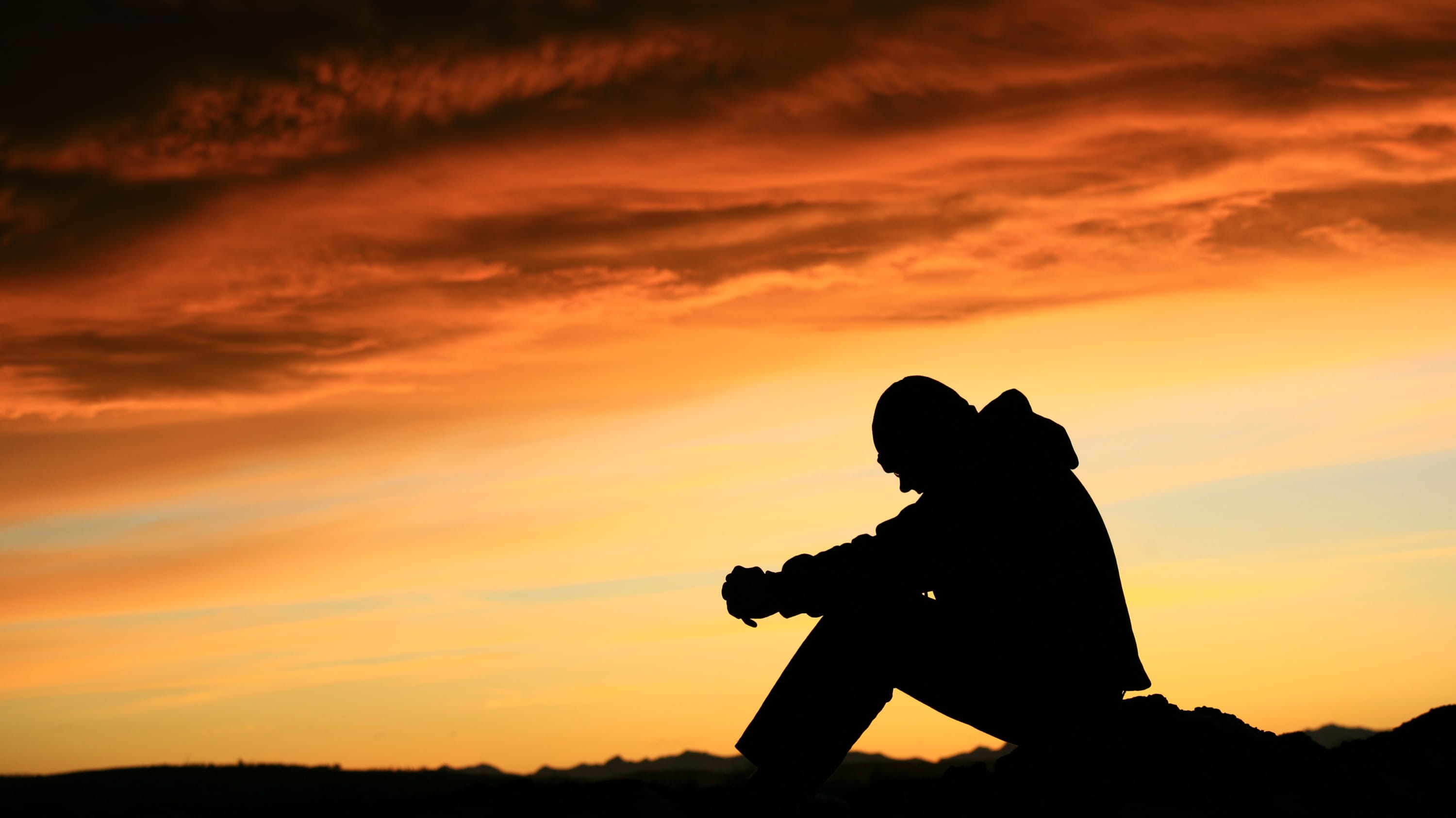 Silhouette of a young man, possibly thinking about his substance use disorder in a time of COVID-19