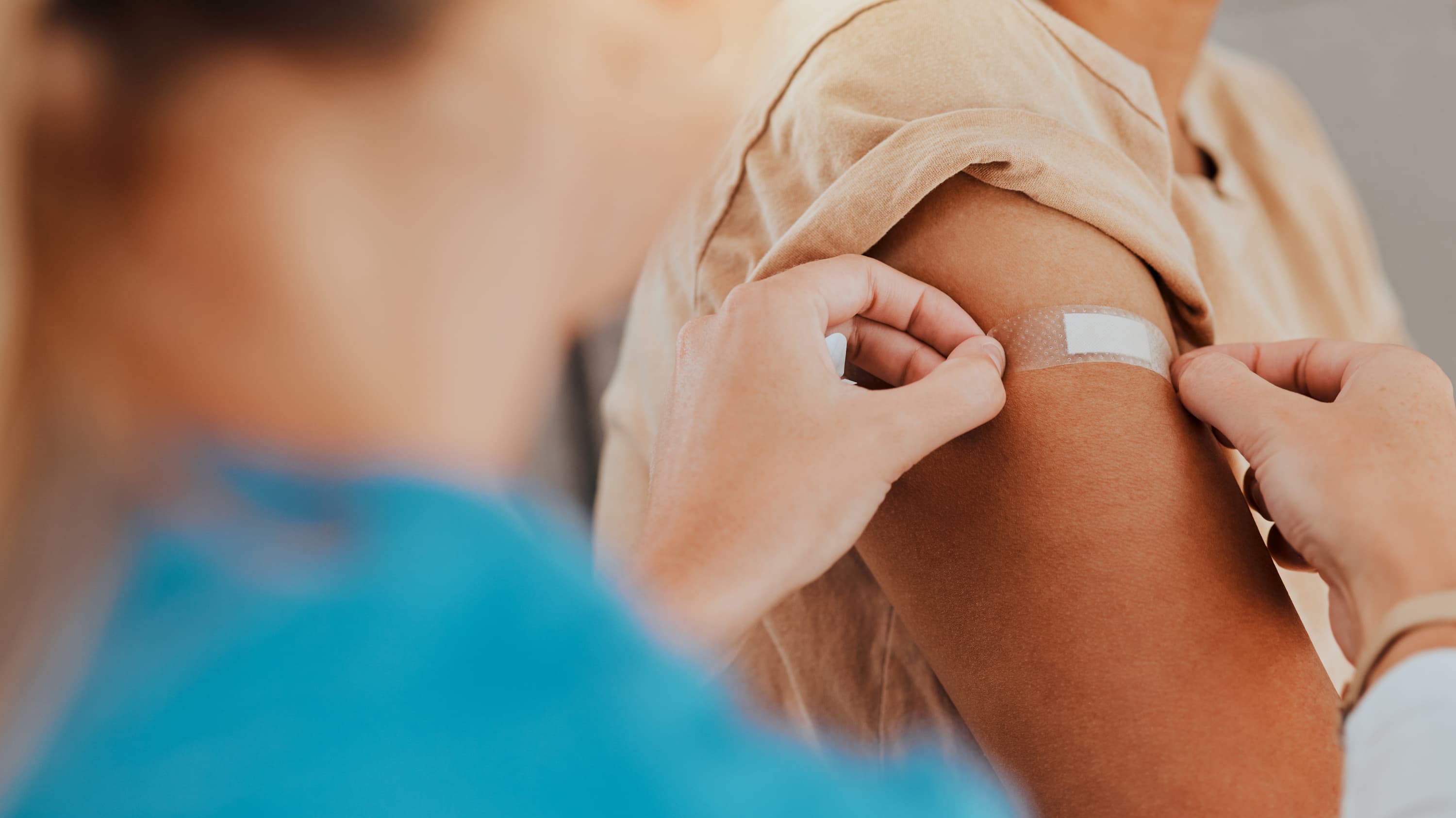 woman receiving a vaccine to protect against rsv, COVID, or flu