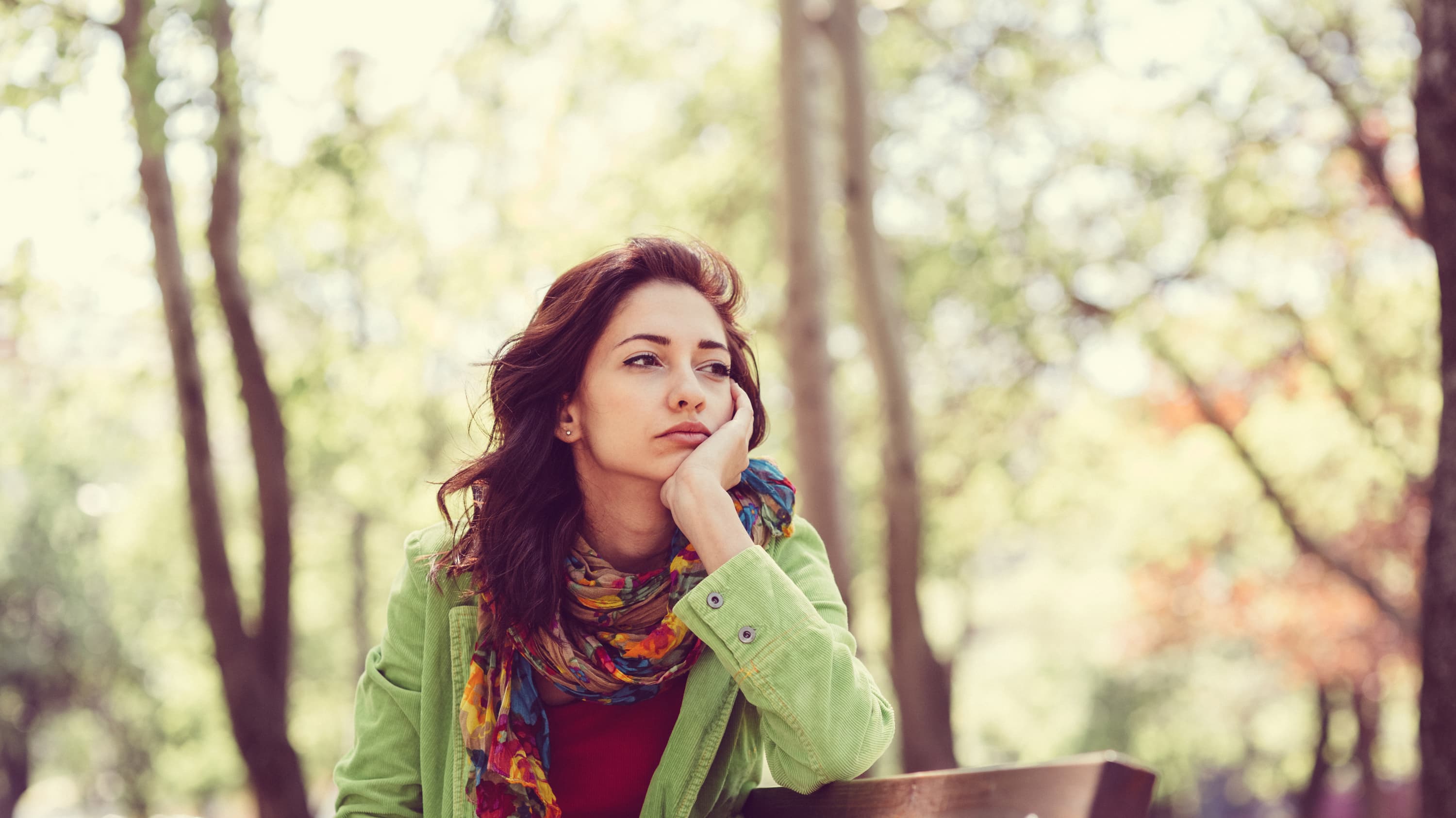 Thoughtful woman, possibly worried about HPV-related cancer