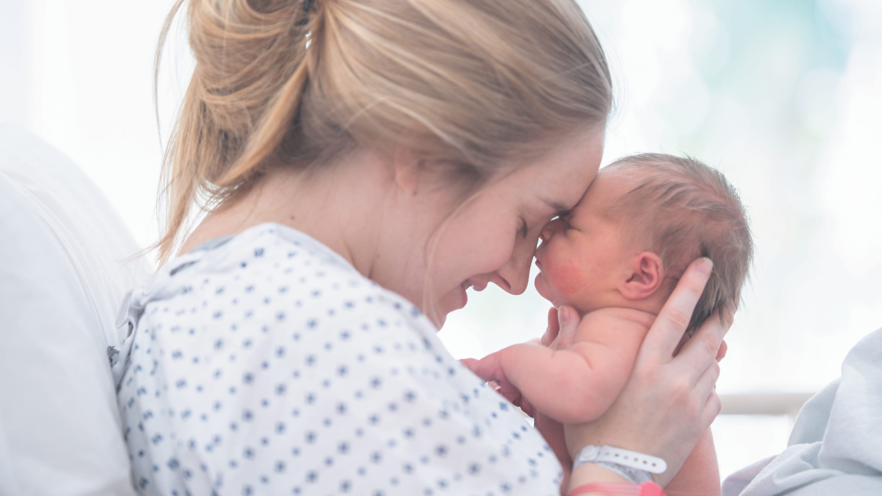 newborn baby and mother, after receiving an epidural during childbirth