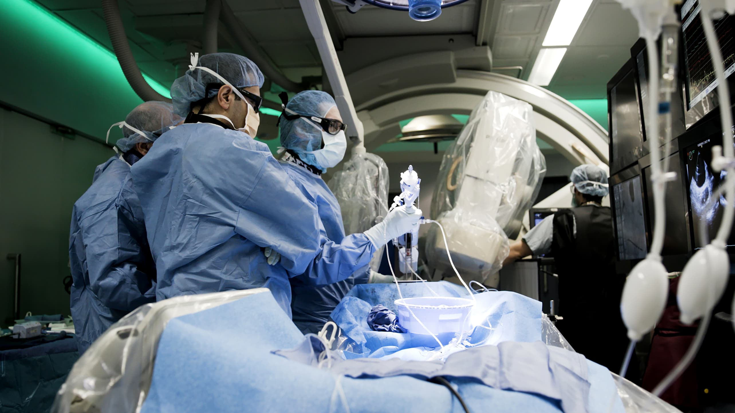 An interventional cardiologists performs a transcatheter mitral valve procedure.