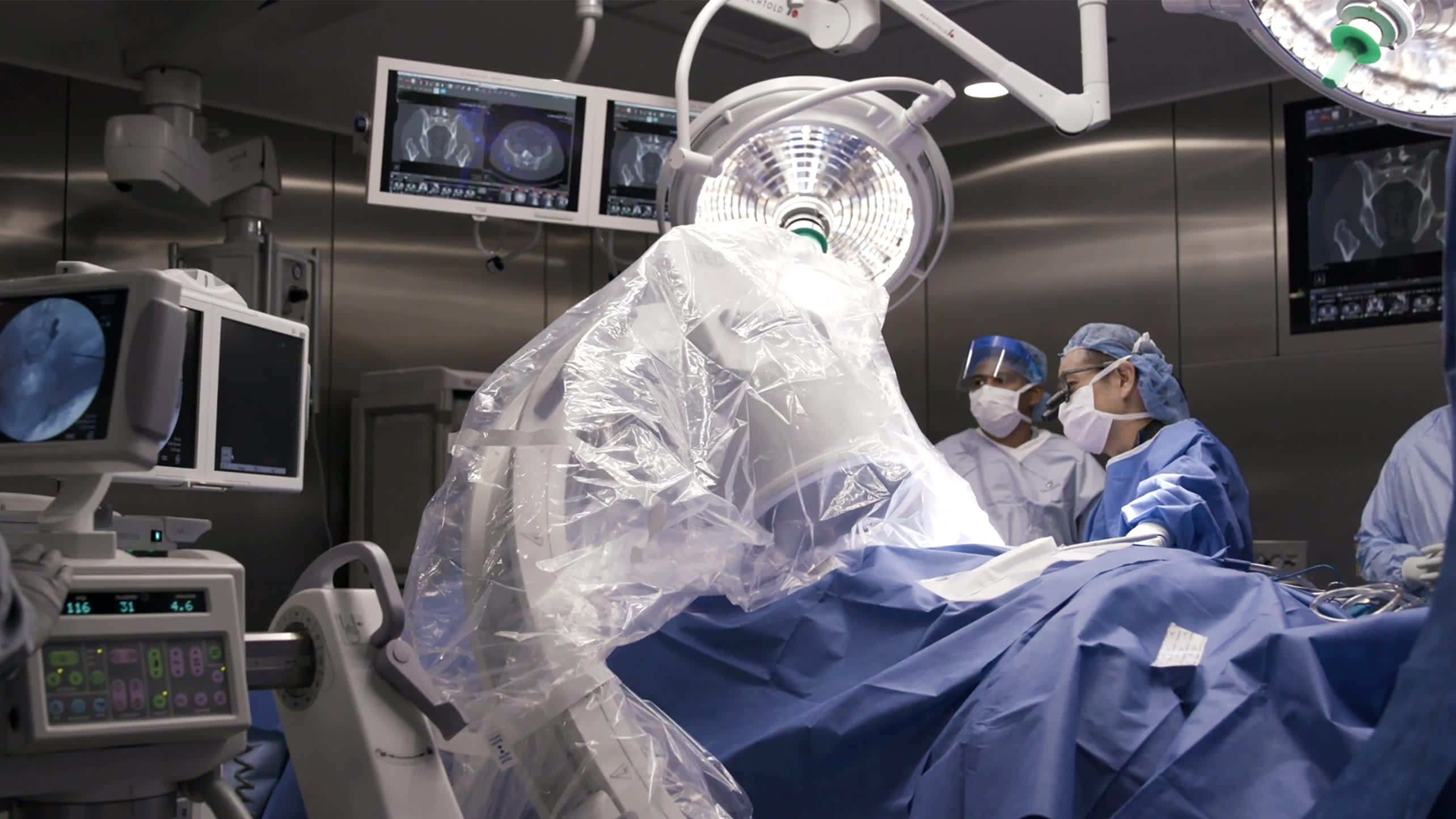Orthopedic surgeons perform an sacroiliac joint fusion surgery.
