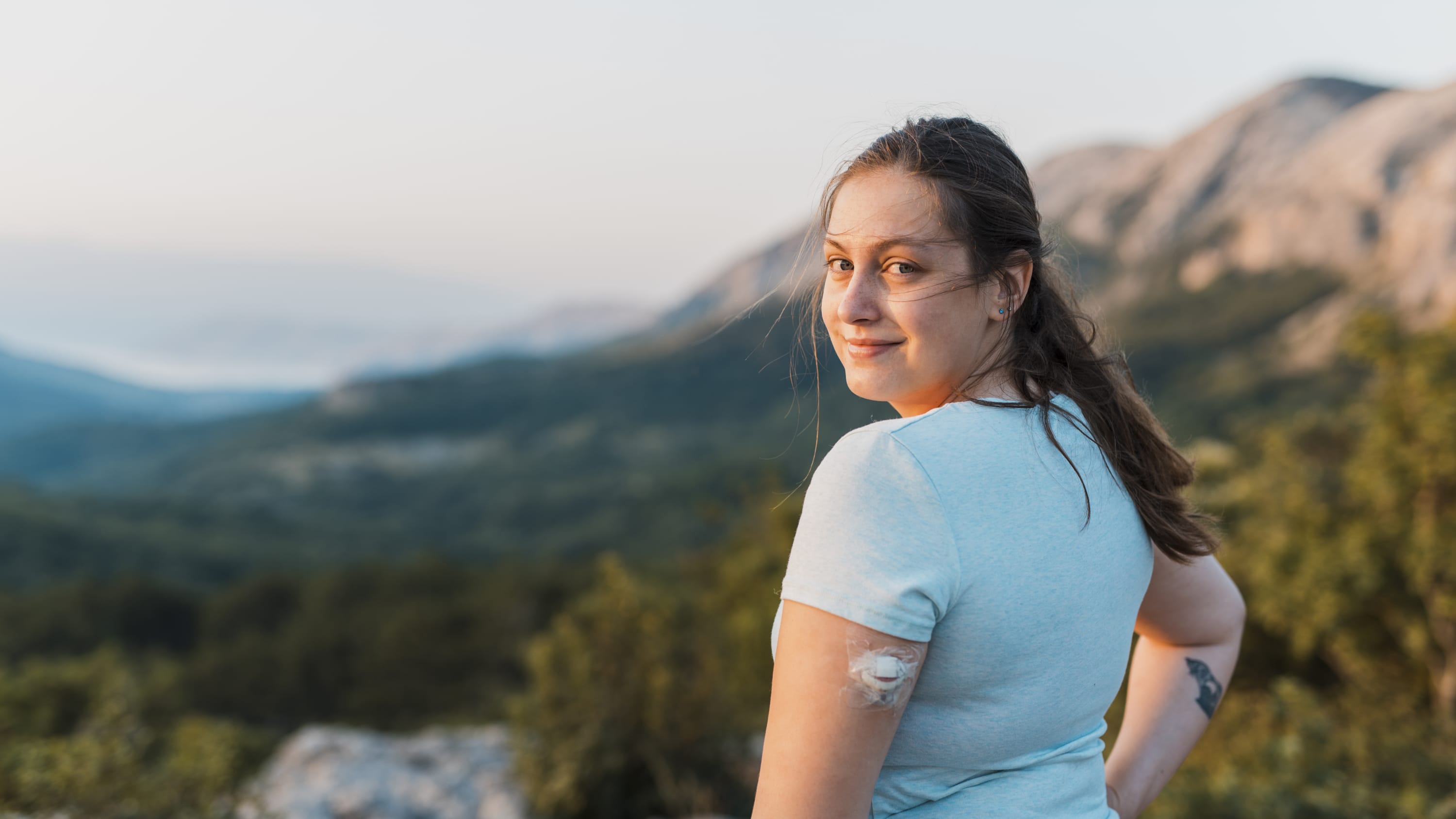 young woman with diabetes hiking after taking hemoglobin A1c test