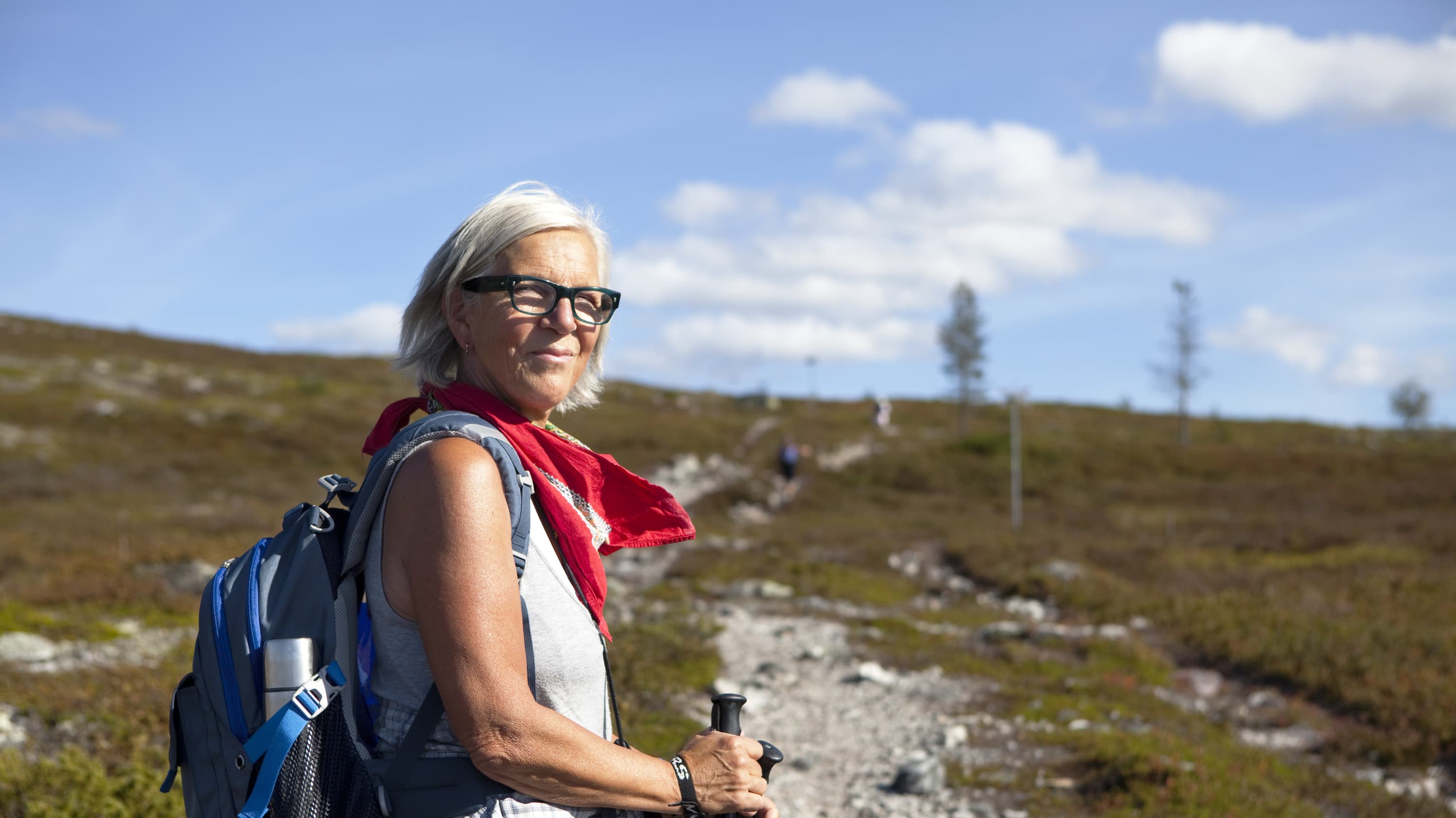 older woman hiking after taking anti-obesity medications before and after joint replacement and bariatric surgery