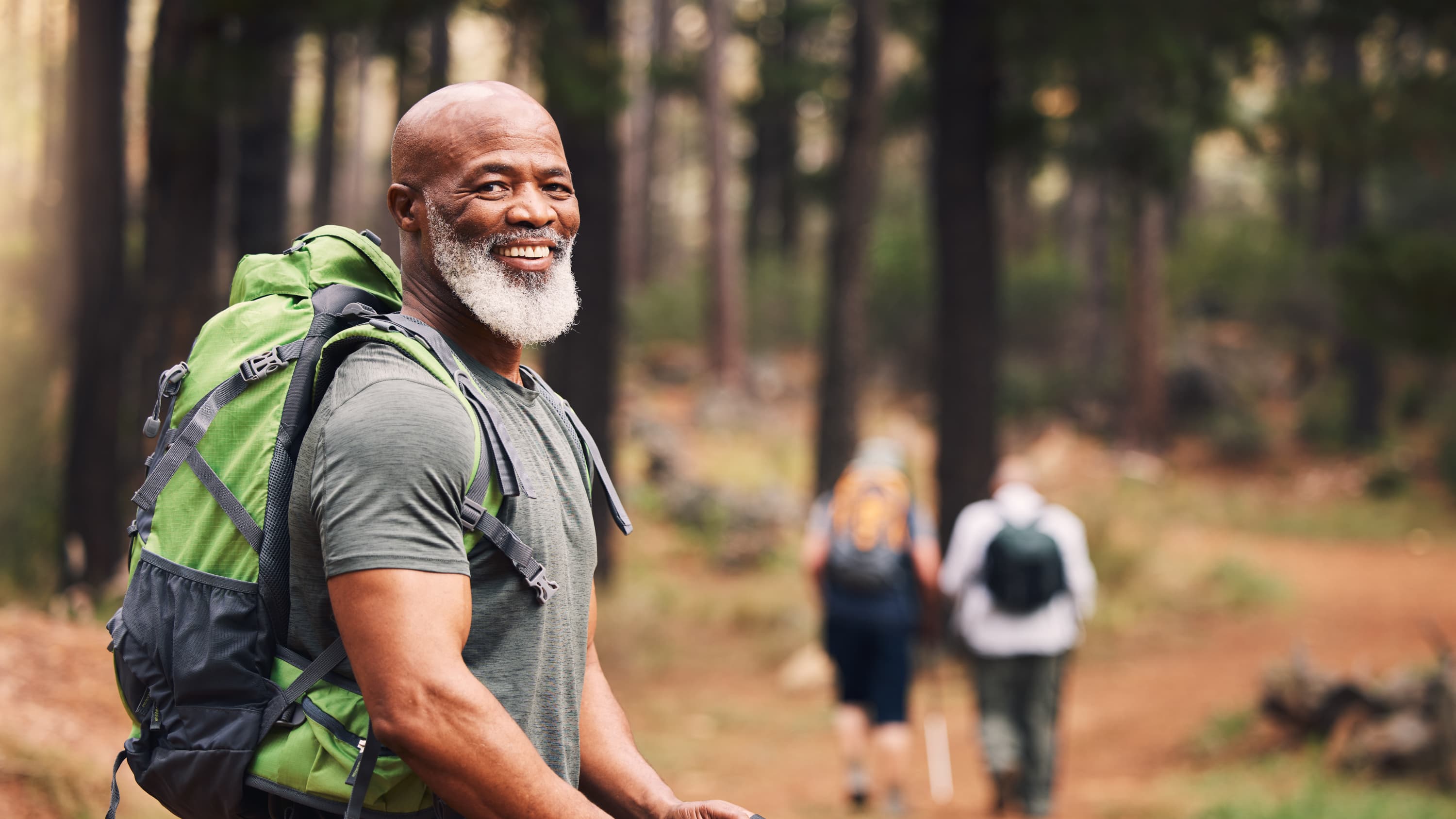 man hiking in woods after heart transplant