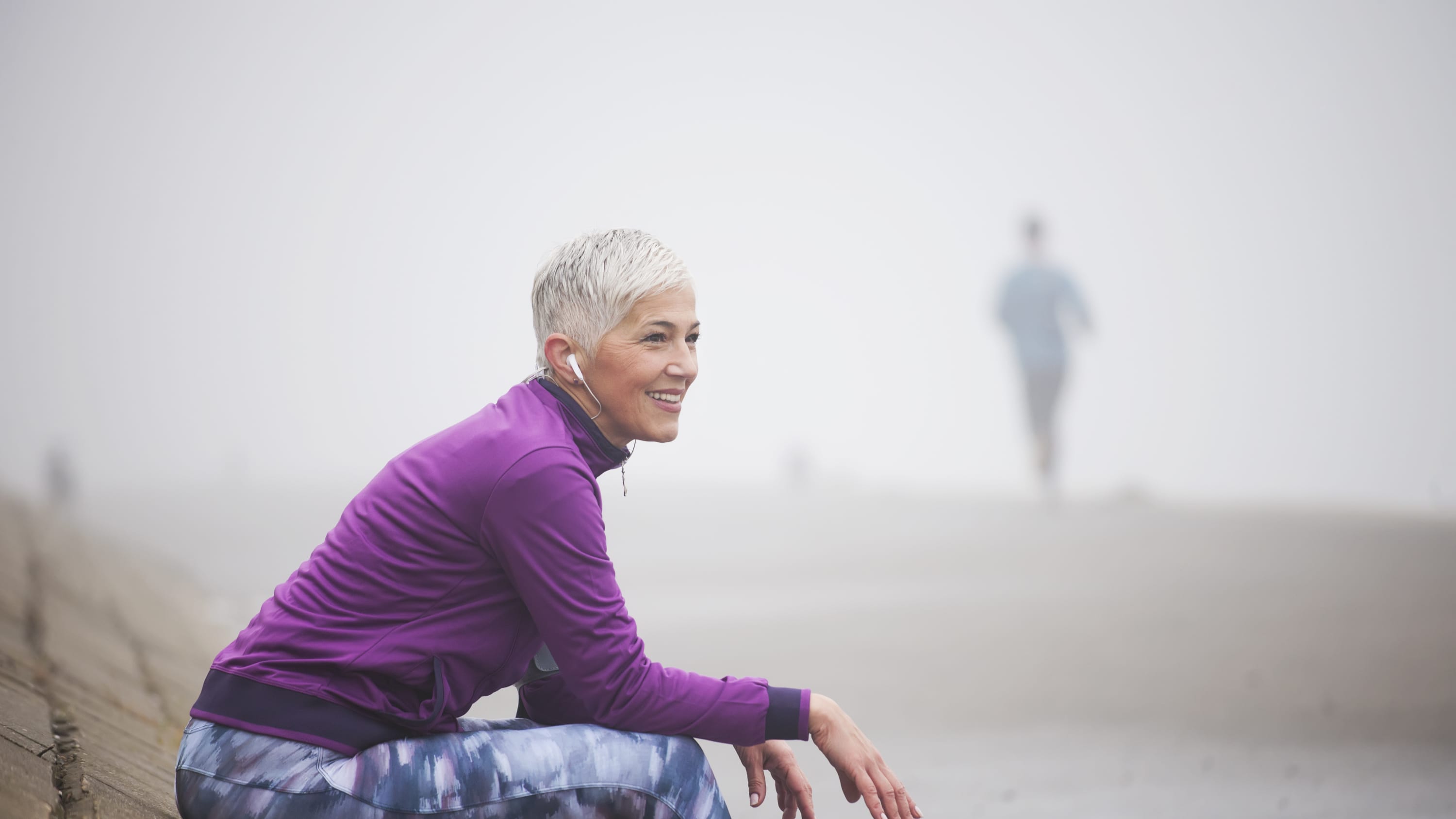 mature woman on the beach after treatment for vulvar cancer