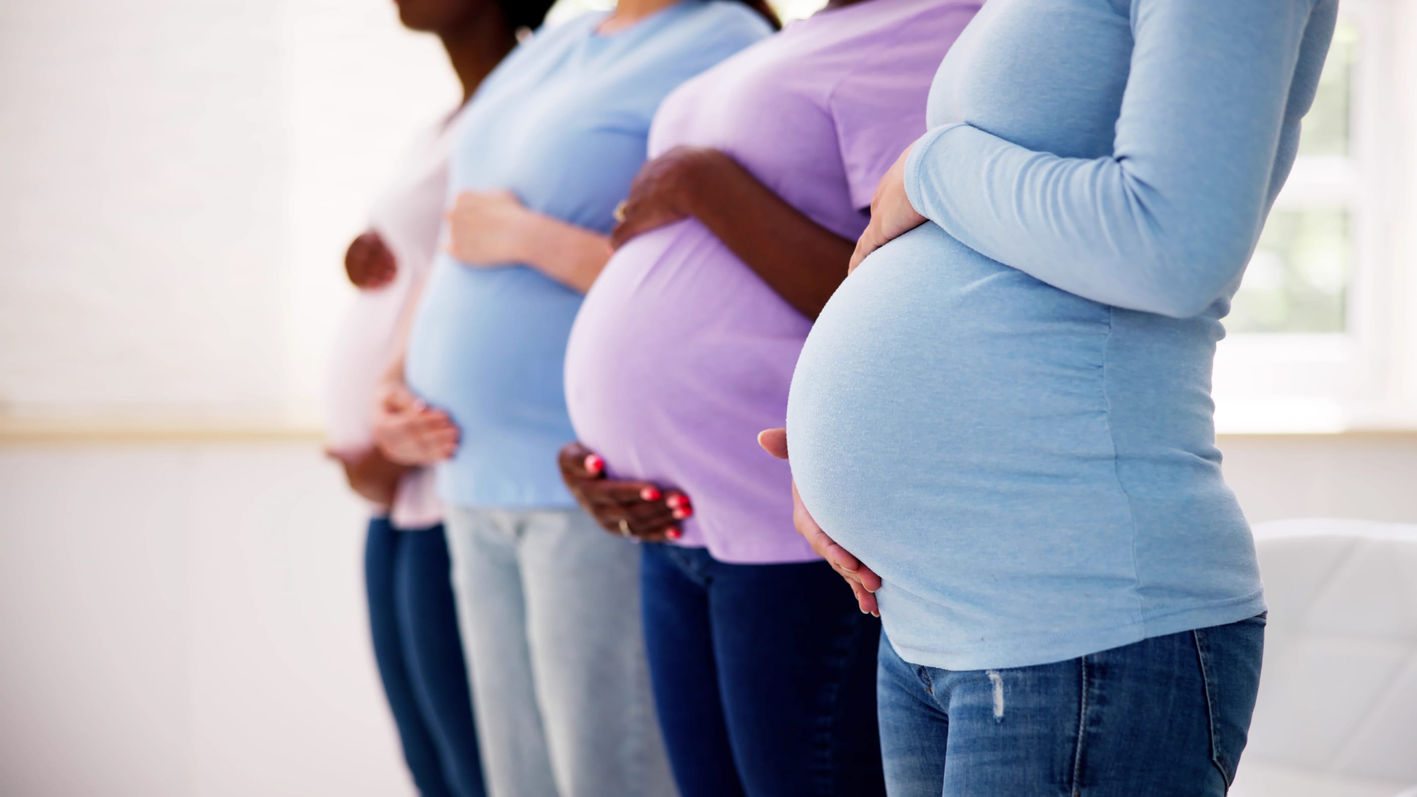 pregnant women with preeclampsia standing in a line