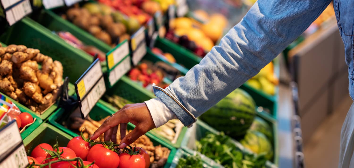 Woman Buying Produce at Grocery Store