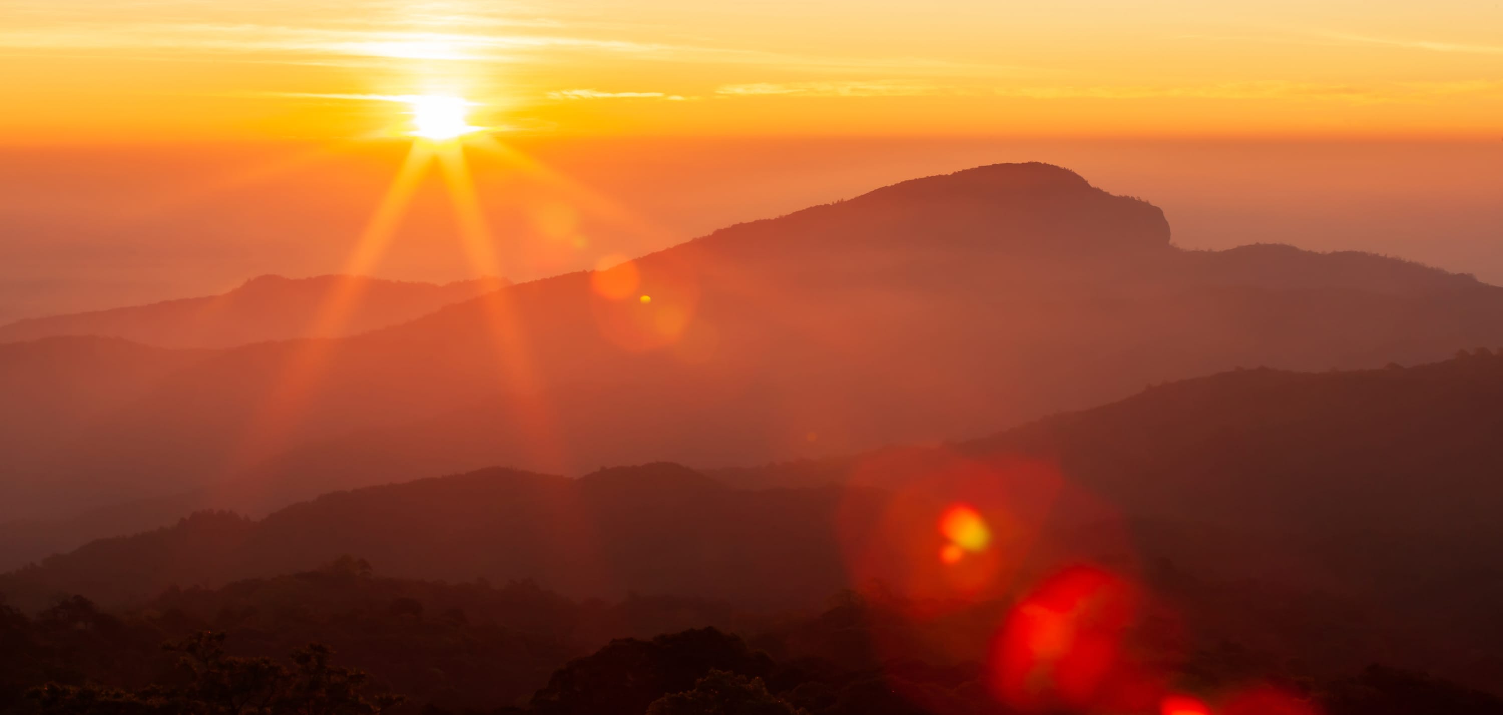sunrise over mountains, representing new treatments for myasthenia gravis