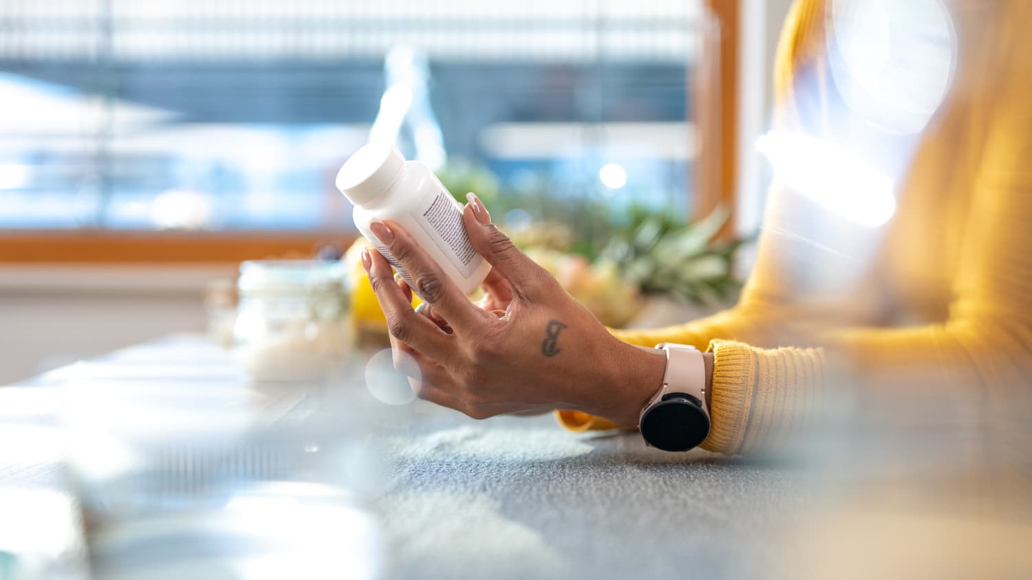 woman looking at proton pump inhibitor (PPI) medications