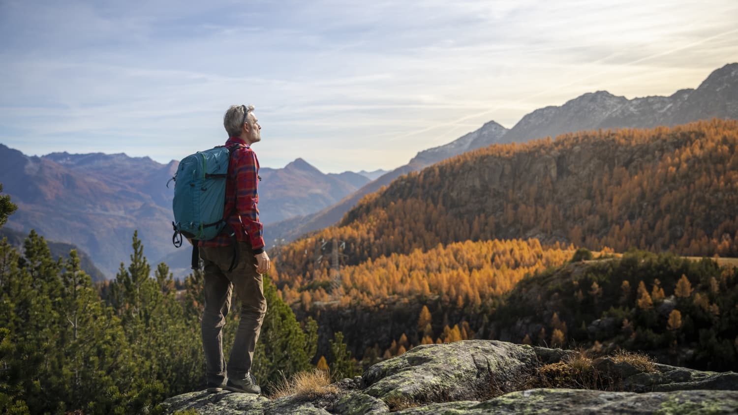 man with non-small cell lung cancer (NSCLC) hiking