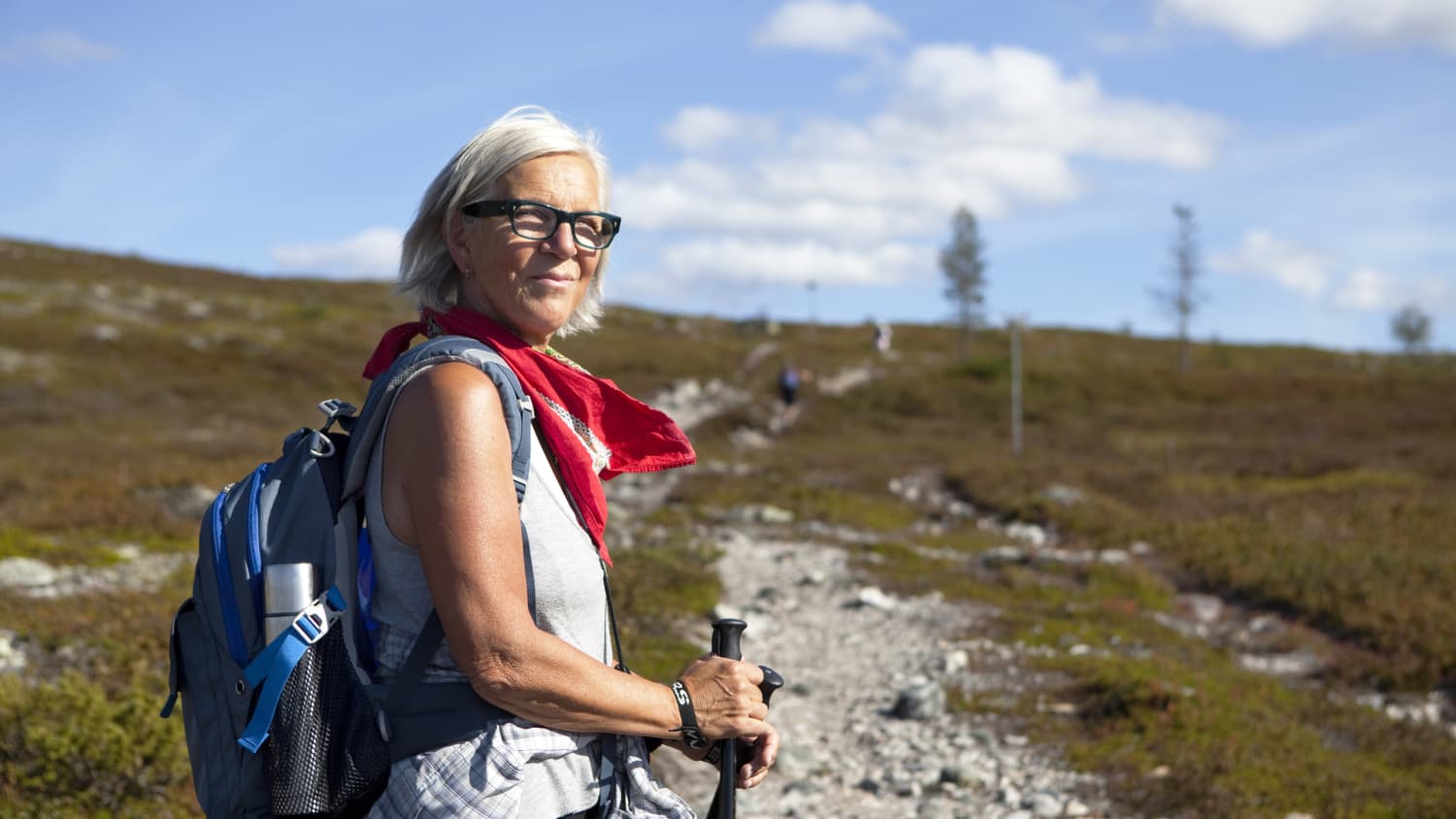 older woman hiking after taking anti-obesity medications before and after joint replacement and bariatric surgery