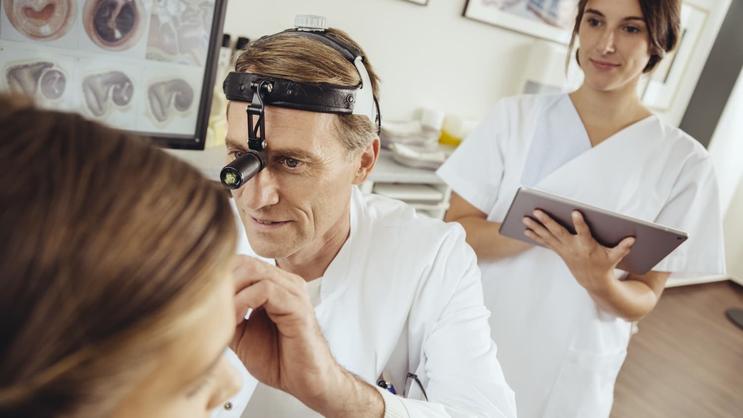 ENT Examines Woman's Ear