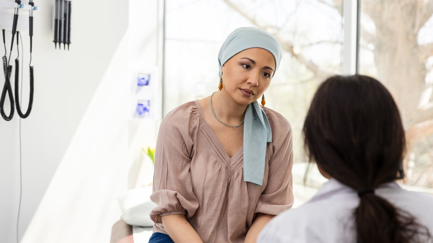 Young Woman with Cancer Talks to Doctor