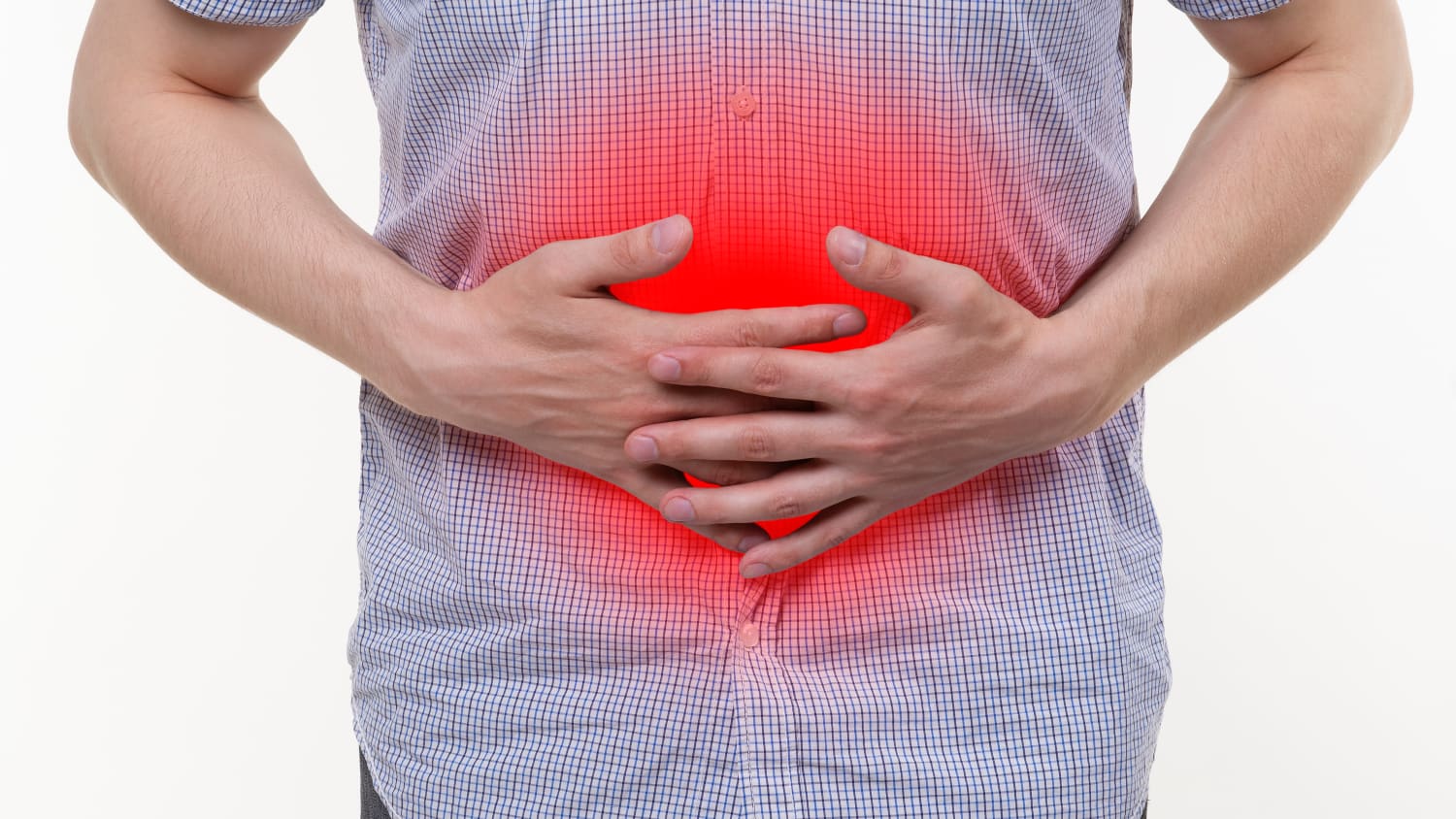 A man with inflammatory bowel disease clutches his stomach, which is highlighted in red. 