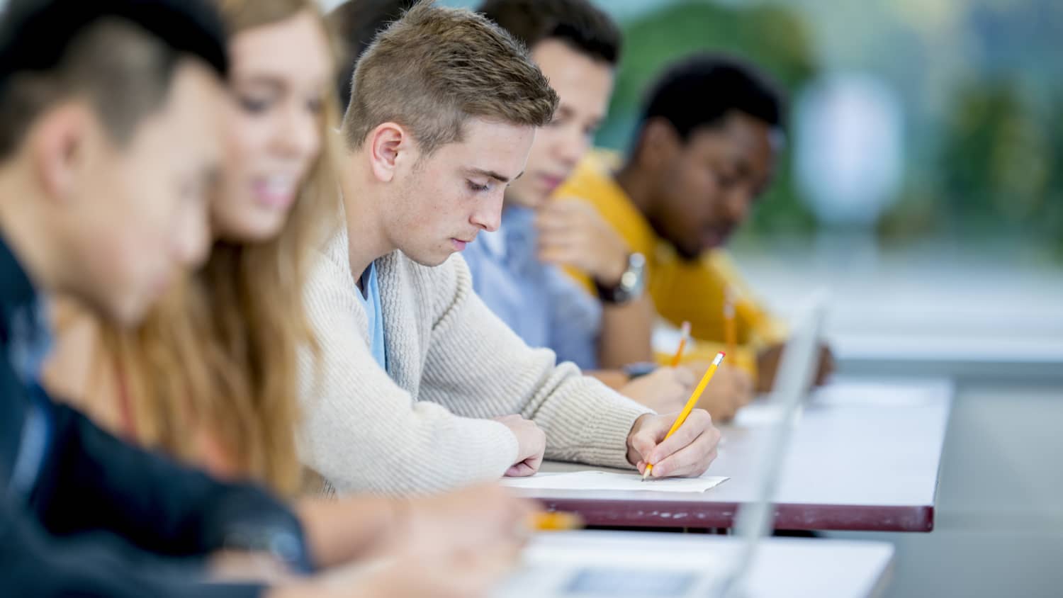 college kid taking an exam, while managing diabetes