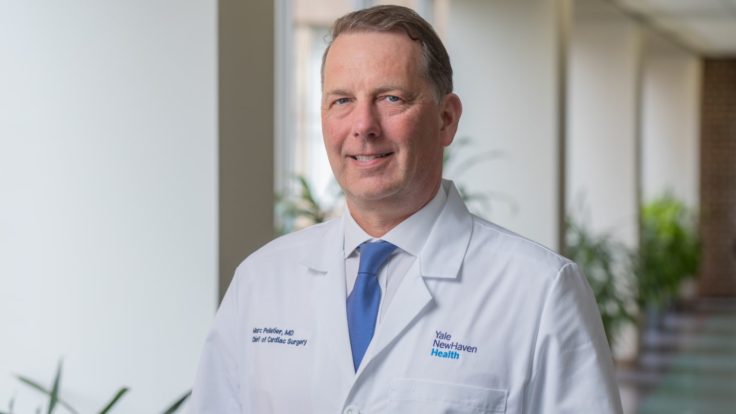 Cardiac Surgery Chief Marc Pelletier, MD, stands in a hallway at Yale New Haven Hospital.