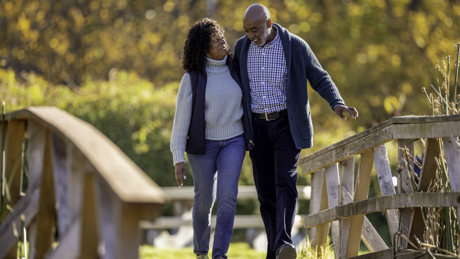 older couple walking in woods after AORIF procedure for bone metastases