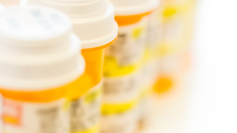 A row of prescription pills for a story about a non-opioid pain medication called suzetrigine (Journavx).