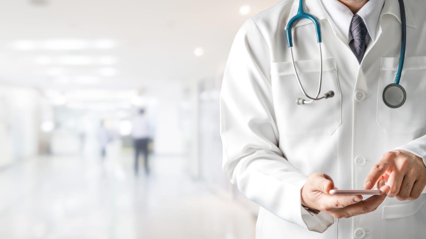 doctor with phone GettyImages-1130034198